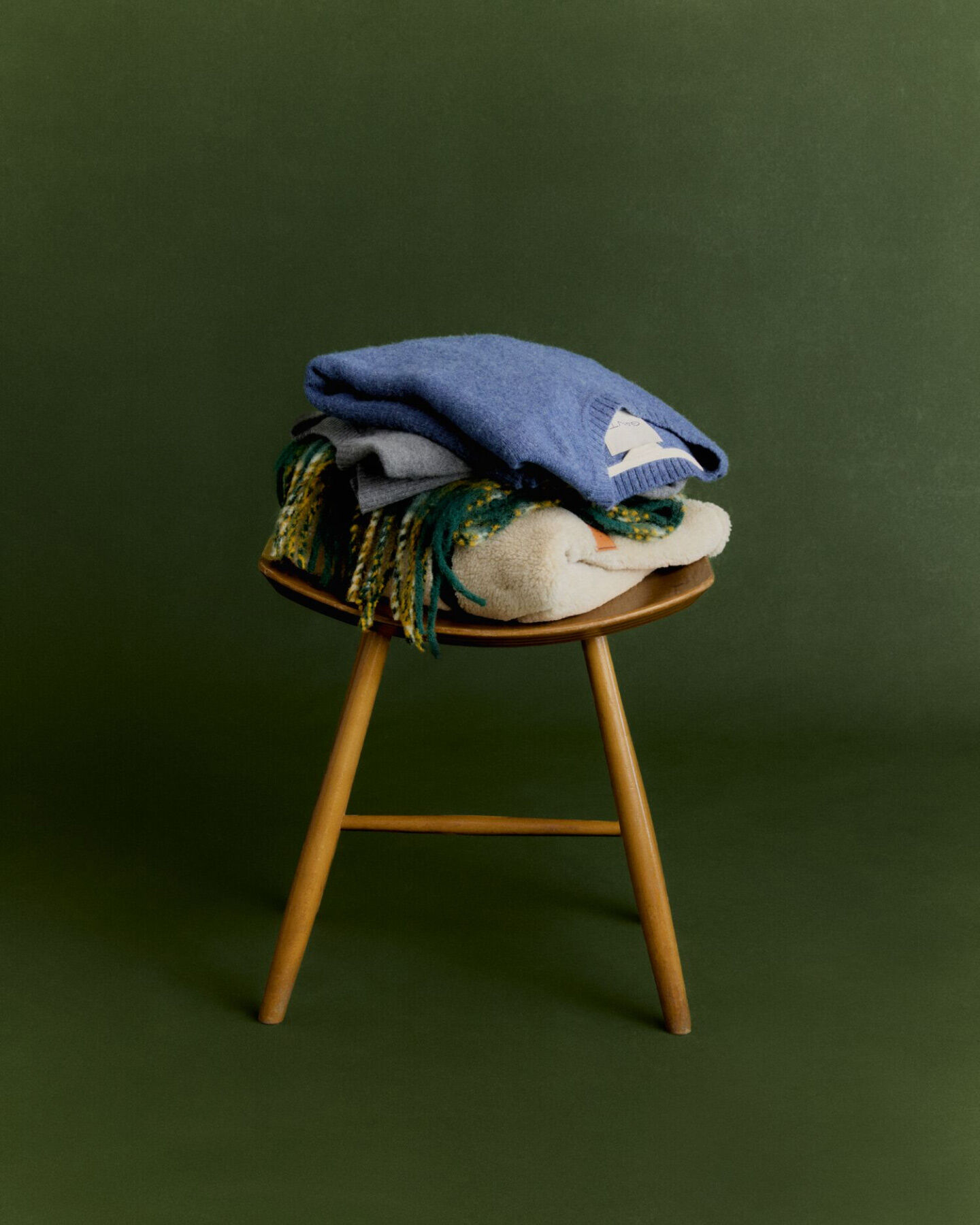 Mens knitwear on stool