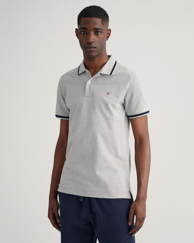 Polo in piqu&eacute; con bordino a spina di pesce