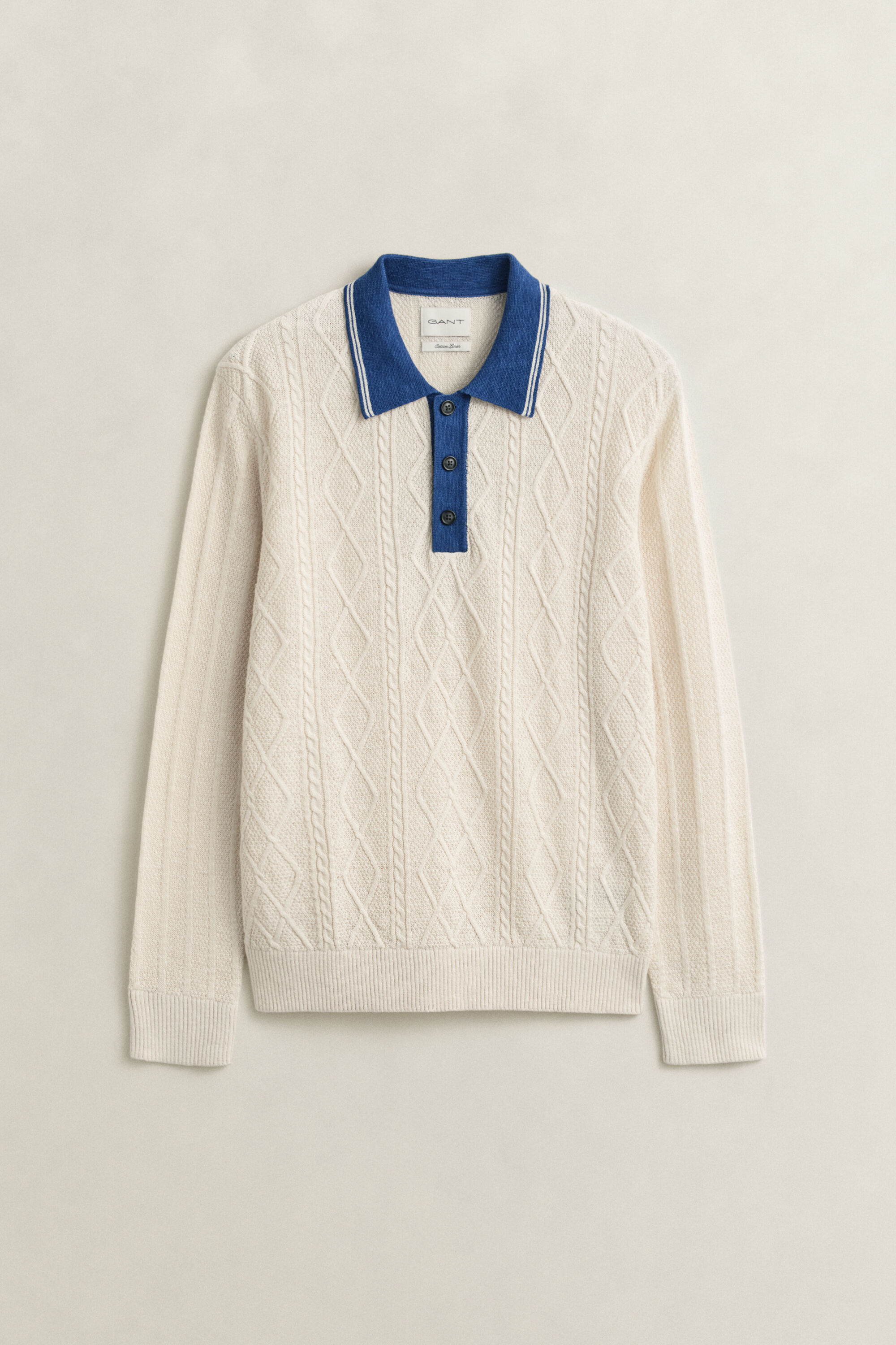Polo in maglia a trecce