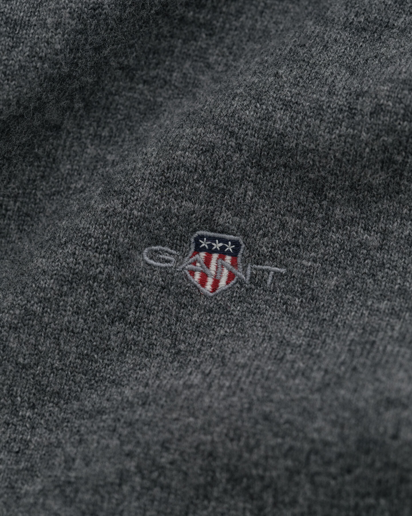 Cardigan con zip in finissima lana d’agnello