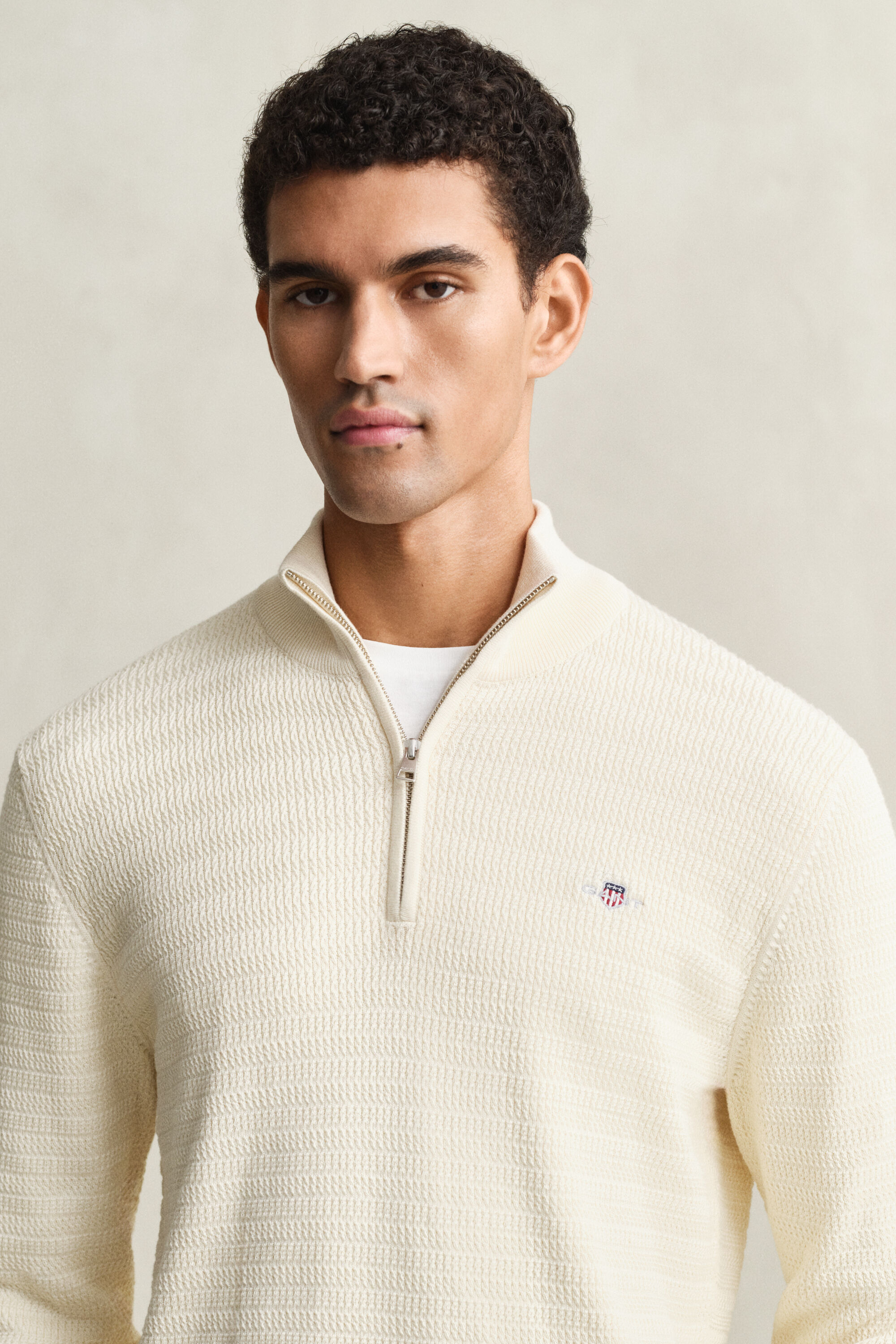 Maglia con zip corta a mini trecce