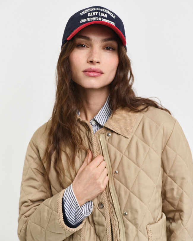 Piumino trapuntato con dettagli in velluto a coste