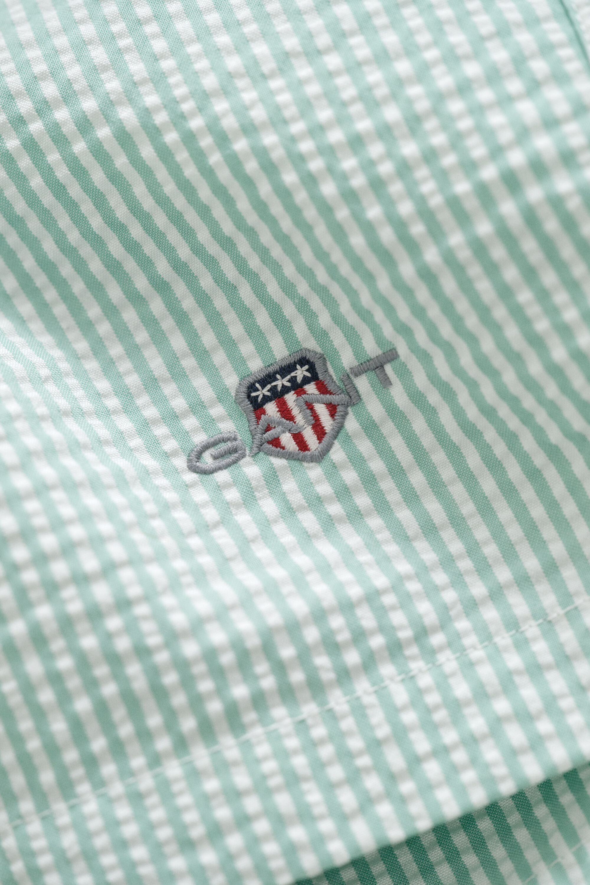 Pantaloncini da bagno in seersucker a righe