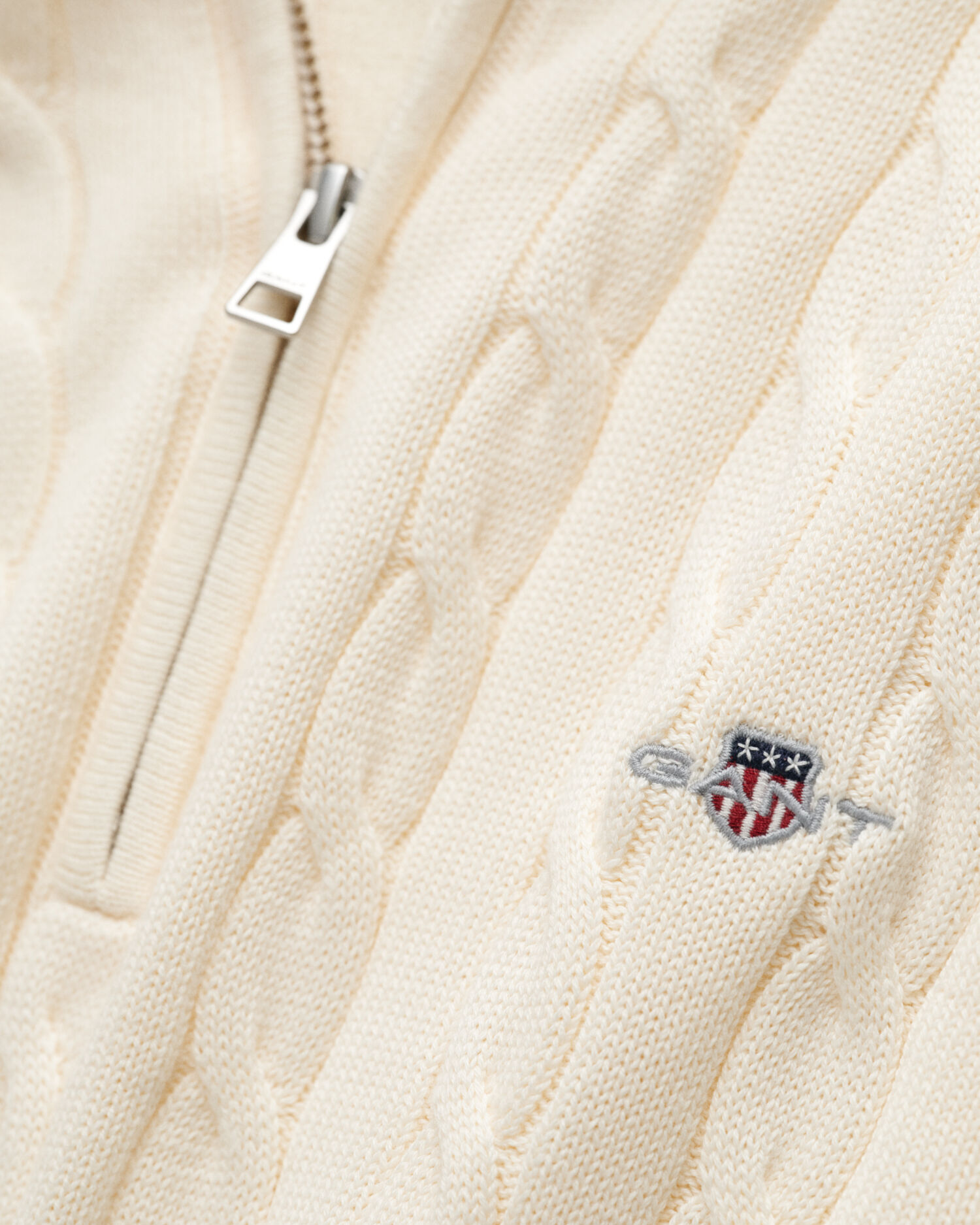 Maglia con zip corta in cotone a trecce