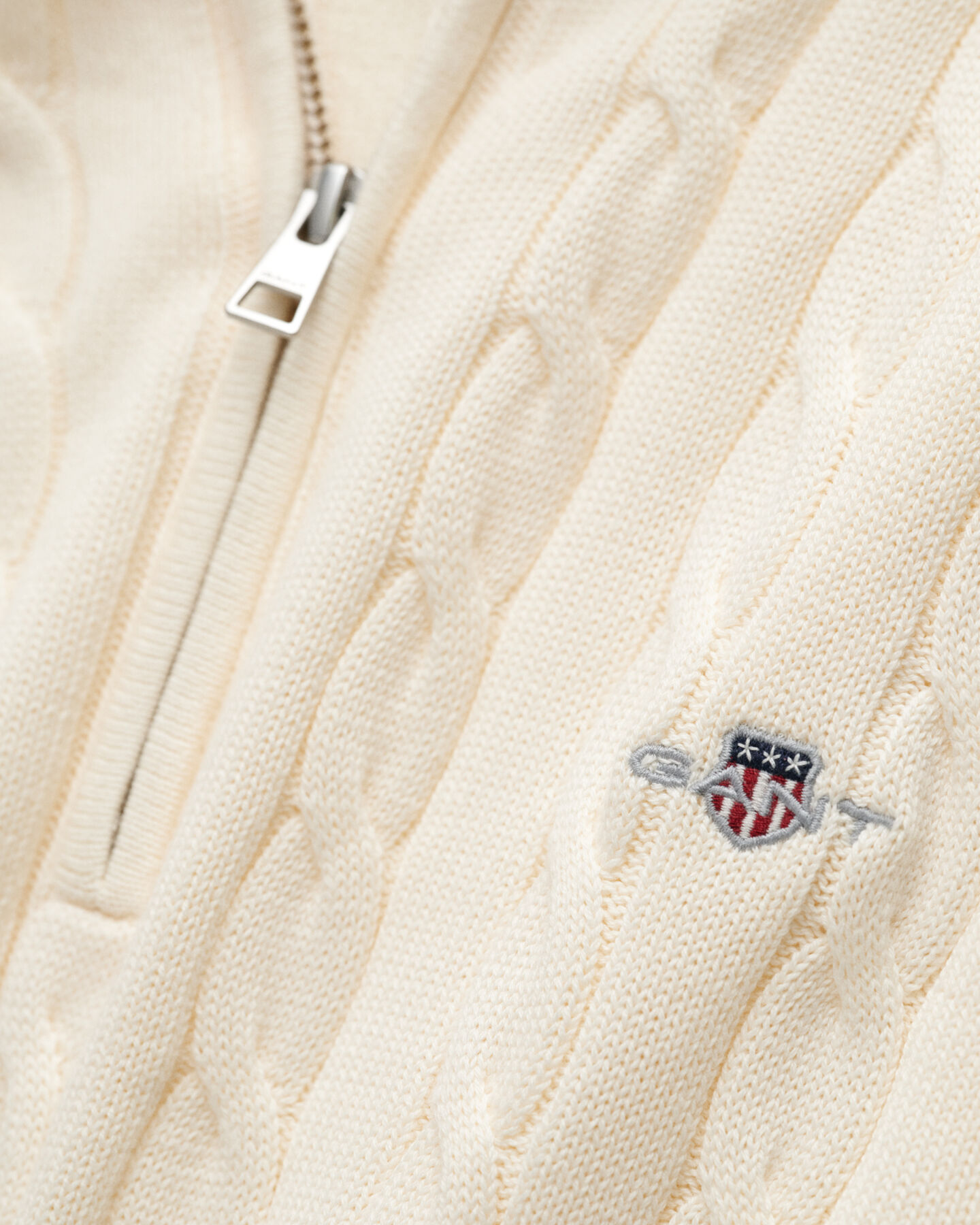 Maglia con zip corta in cotone a trecce