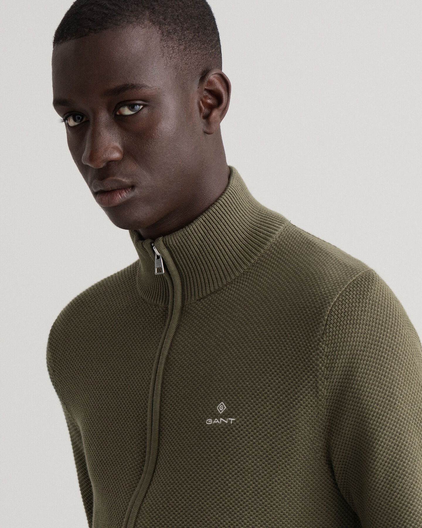 Cardigan in piqu&eacute; di cotone con zip corta