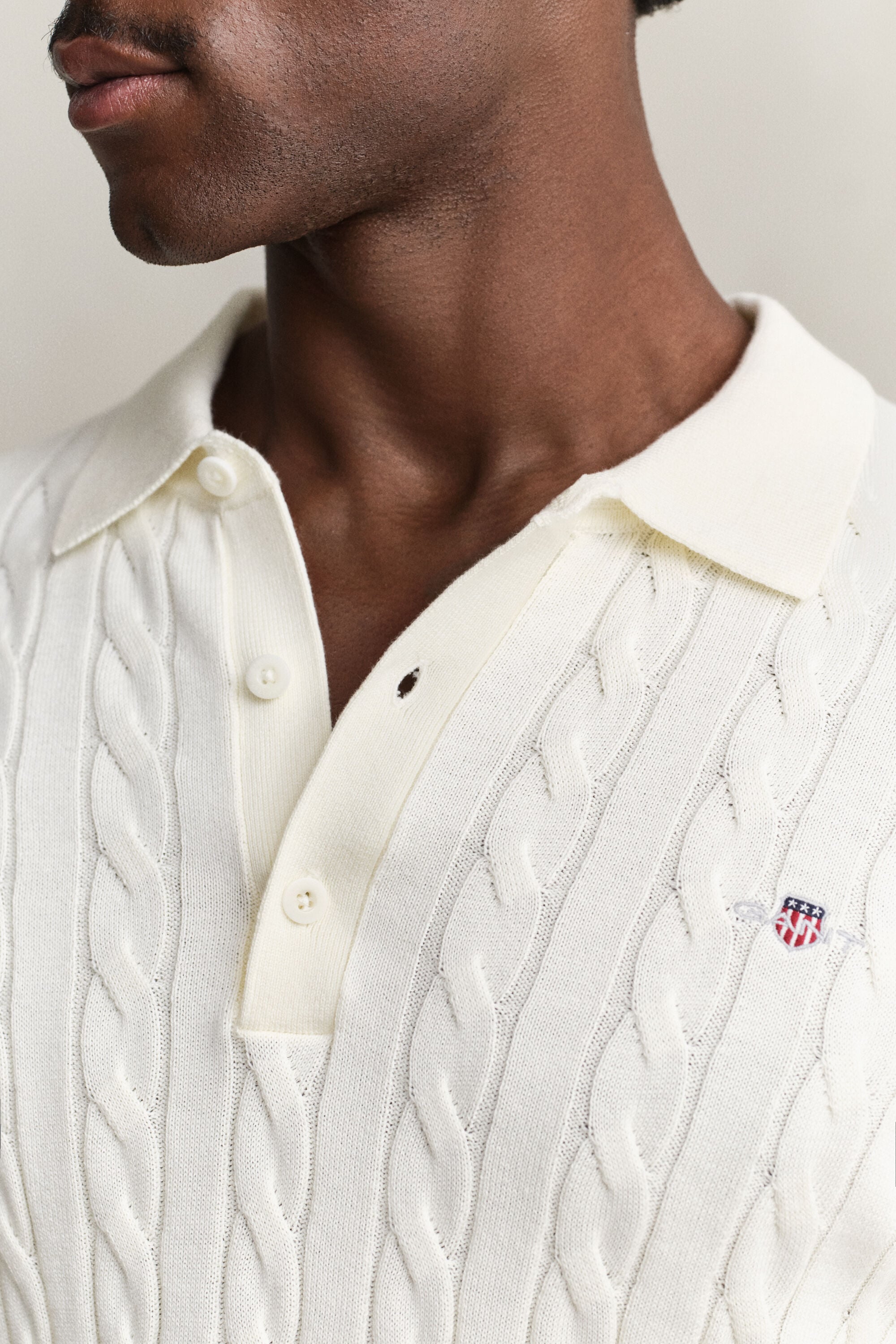 Polo in maglia a trecce in cotone