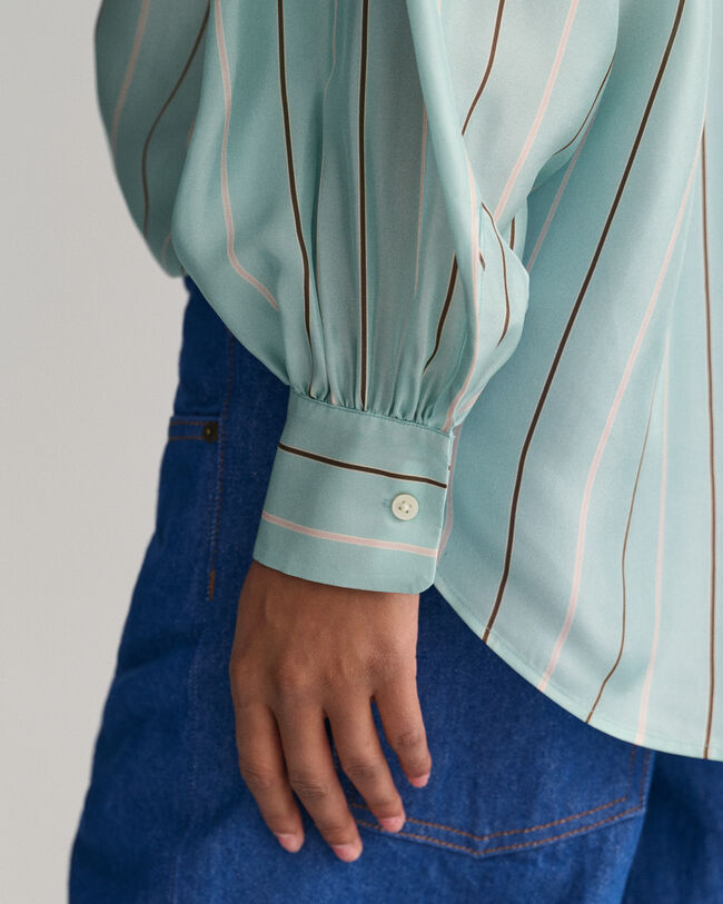 Blusa con fiocco a righe in seta