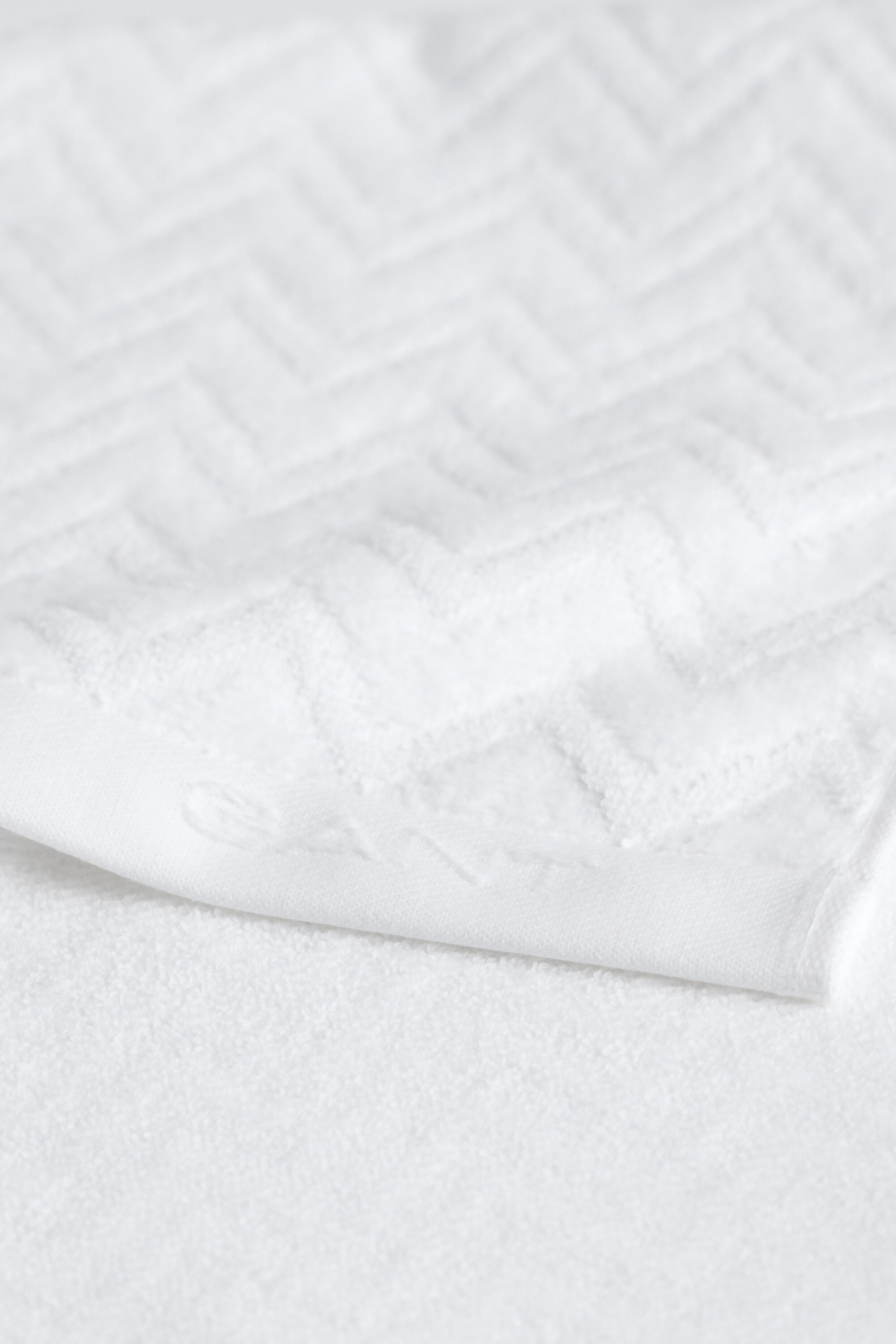 Asciugamano jacquard con motivo a spina di pesce 30 x 50