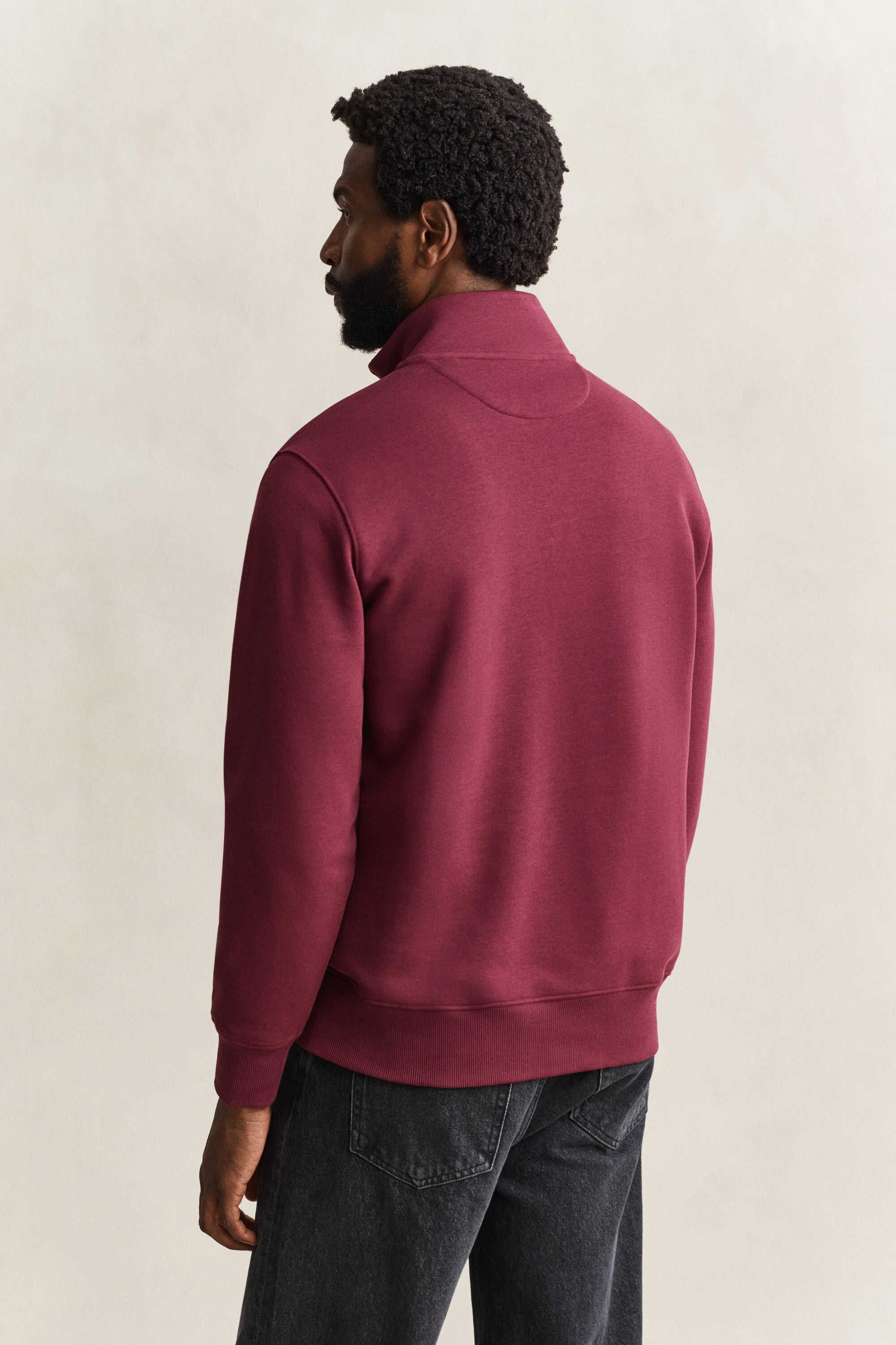 Felpa Shield con zip corta