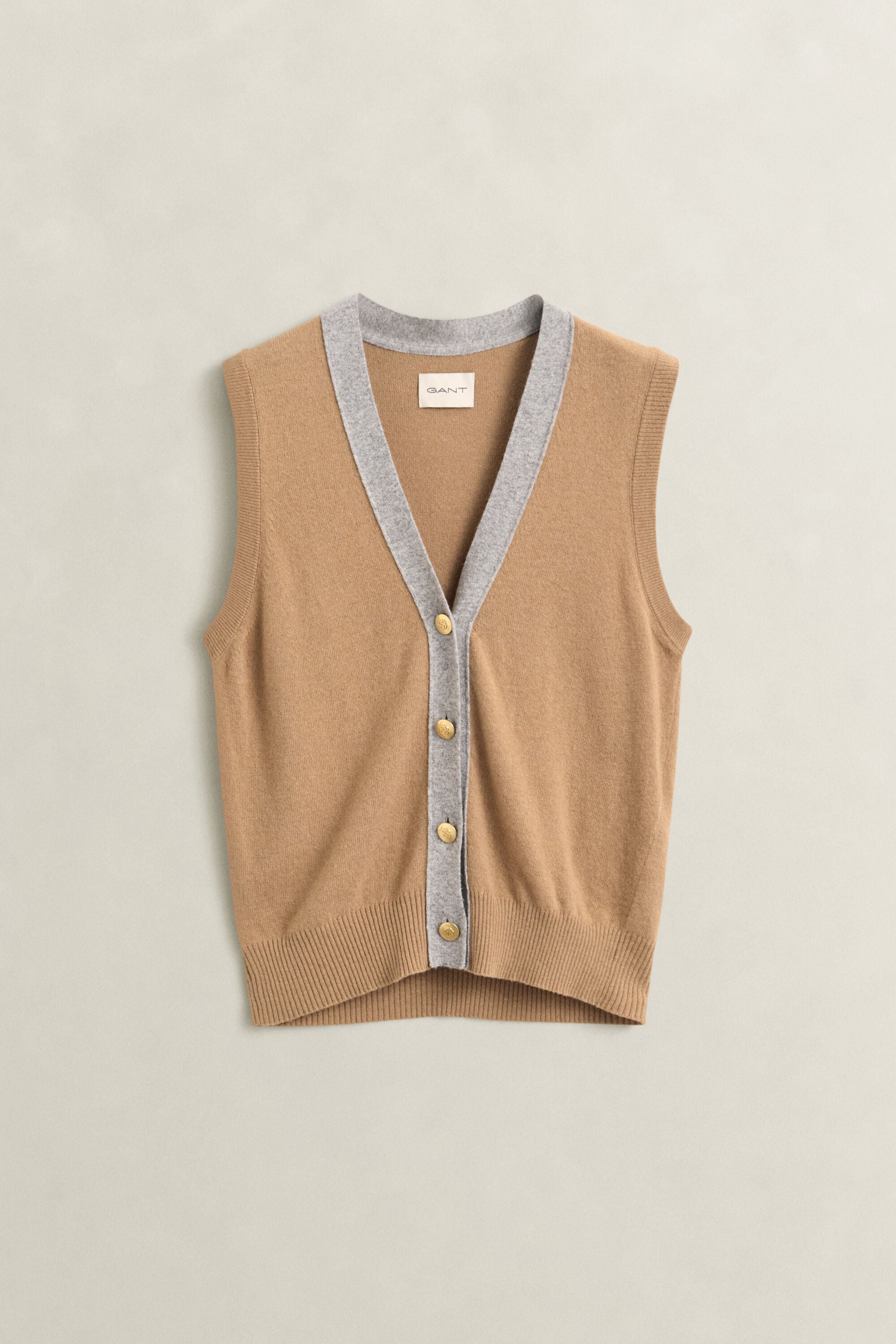 Piumino smanicato in maglia con colore a contrasto