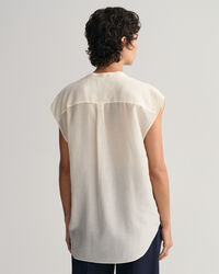 Blusa smanicata con colletto alla coreana