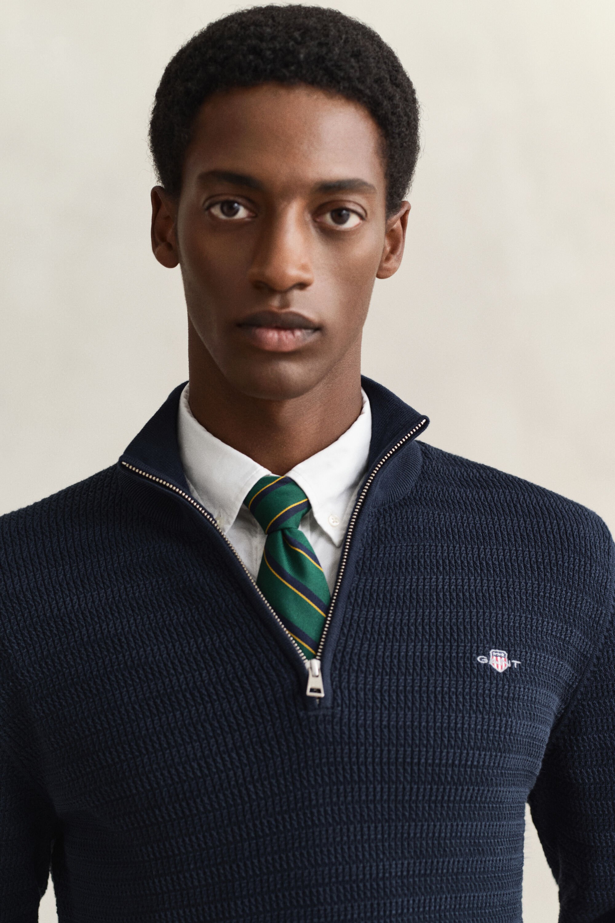 Maglia con zip corta a mini trecce