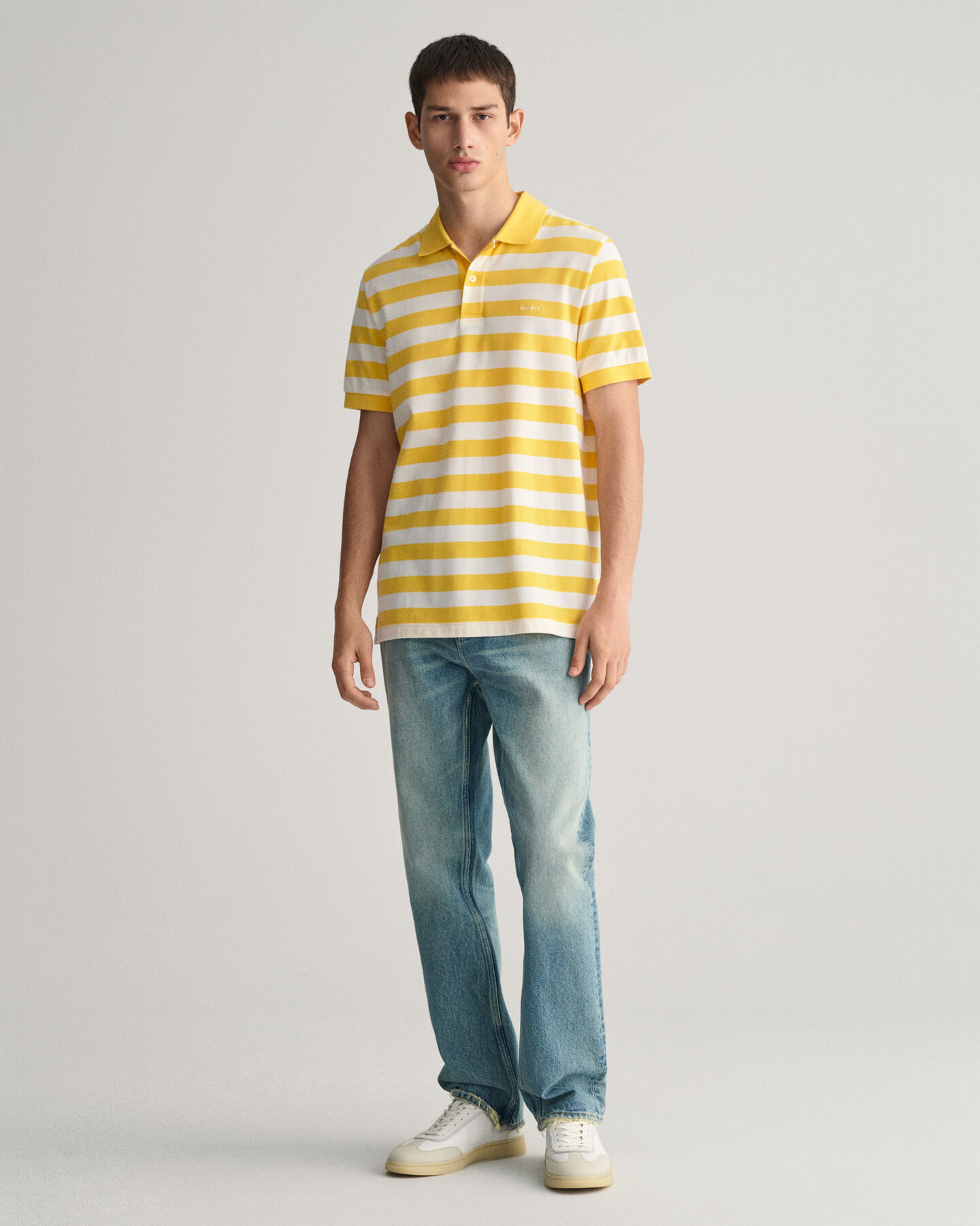 Polo in piqu&eacute; a righe larghe