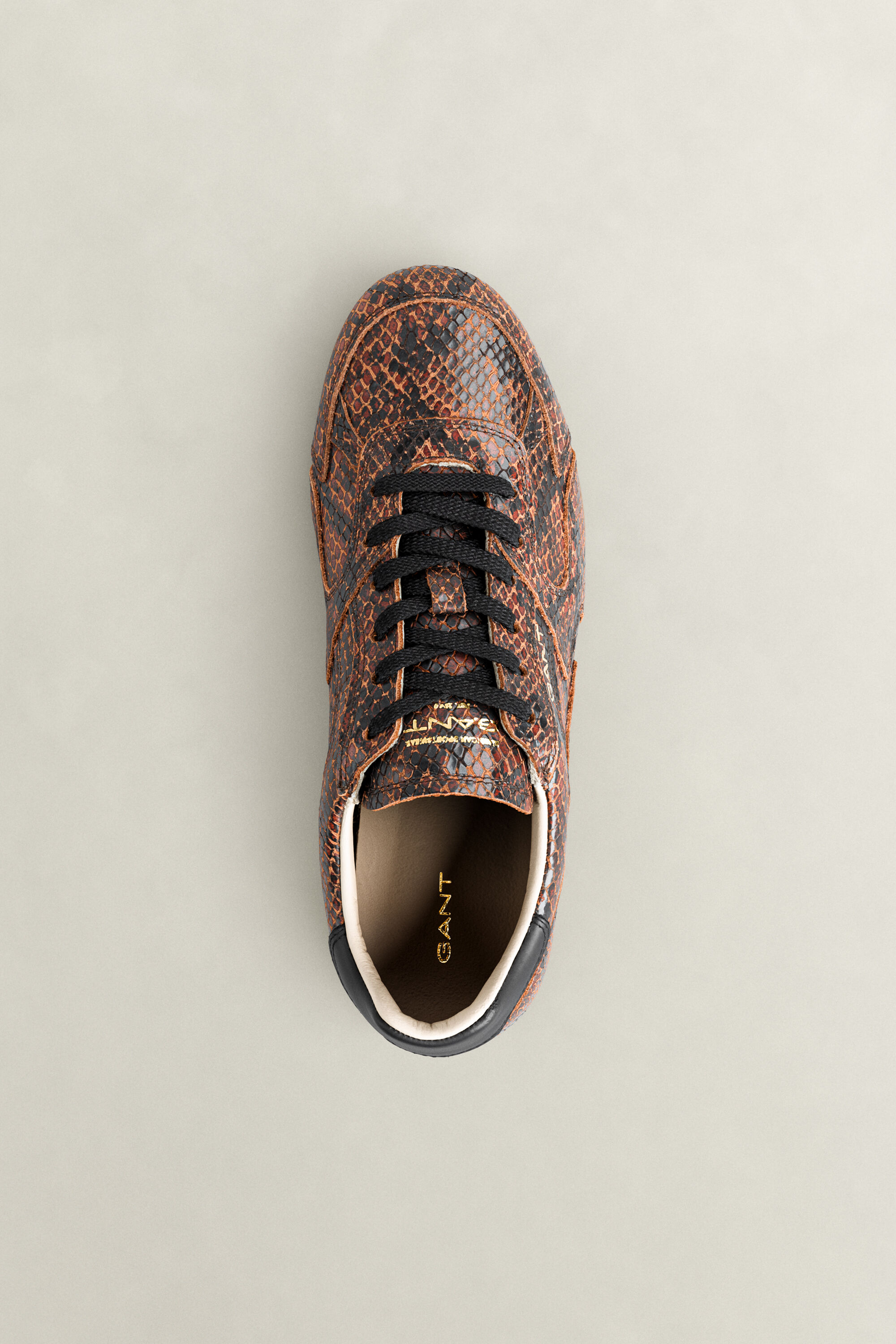 Sneakers Spelly in pelle con effetto serpente
