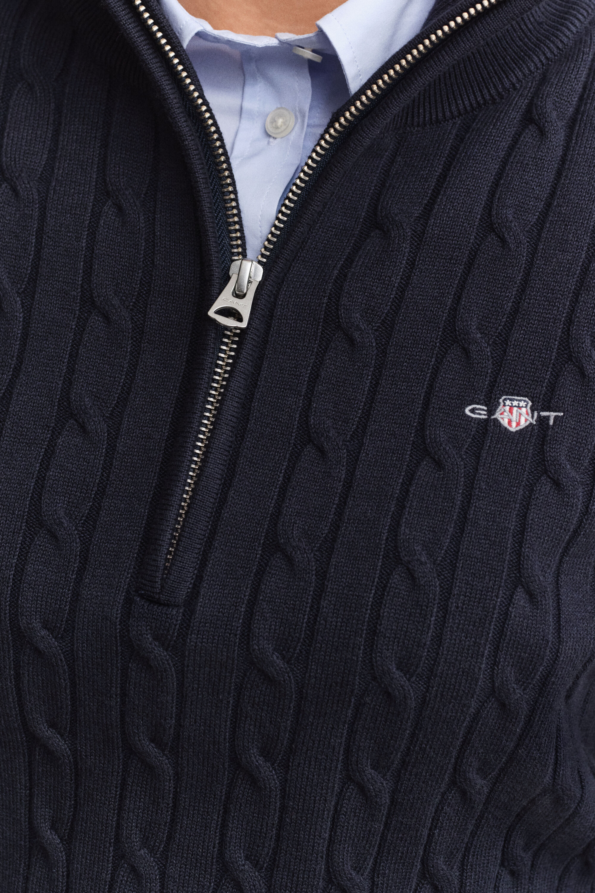 Maglia con zip corta elasticizzata a trecce