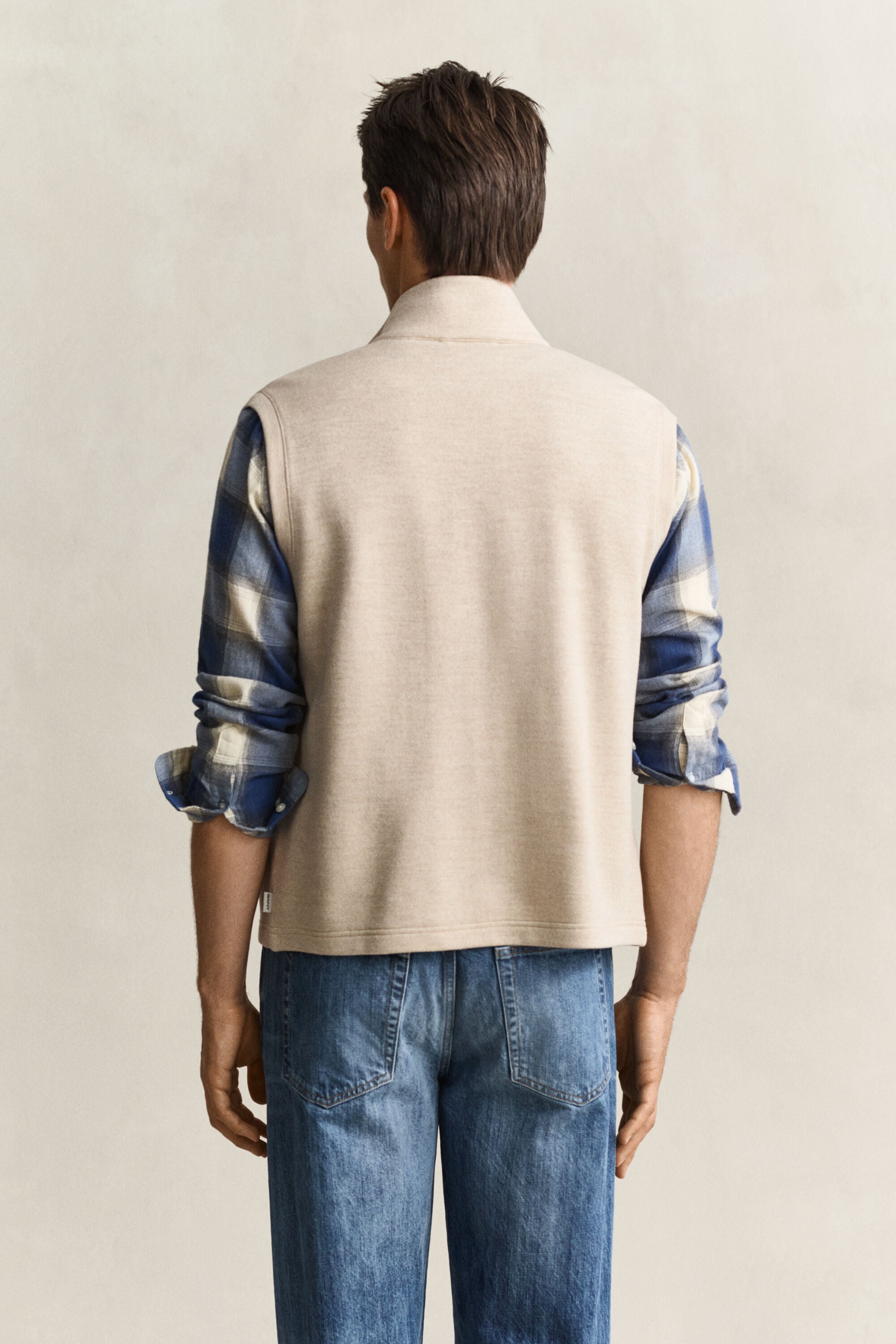 Piumino smanicato con zip