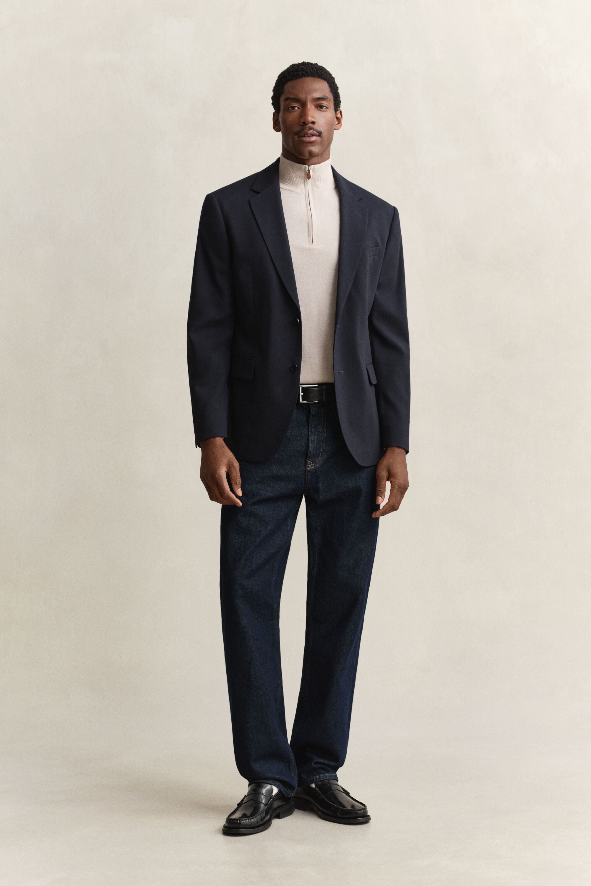 Maglia in lana merino a coste con zip corta