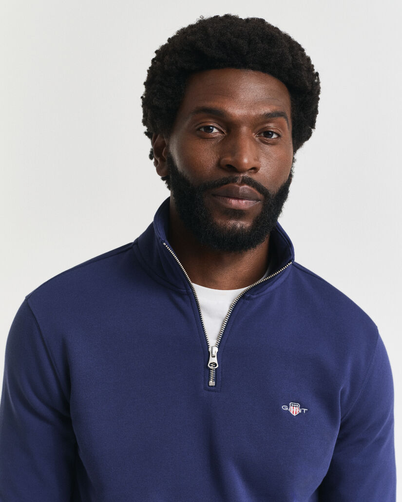 Felpa Shield con zip corta