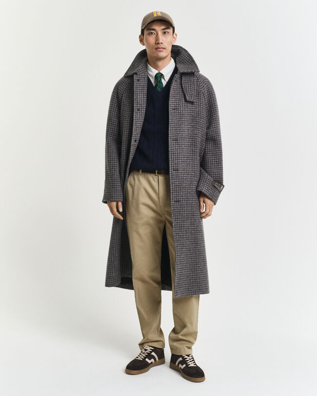 Piumino smanicato a trecce in morbida lana d’agnello