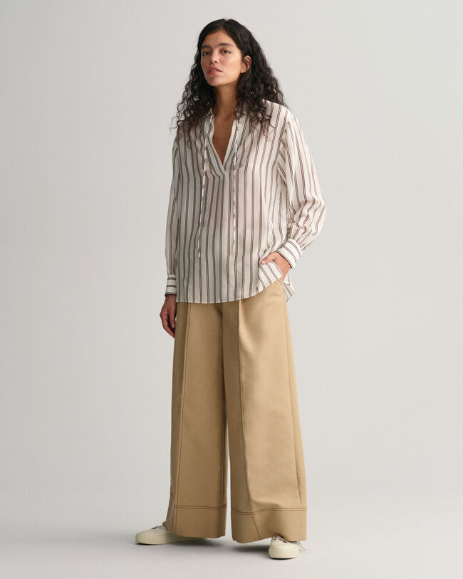 Blusa con scollo a V a righe