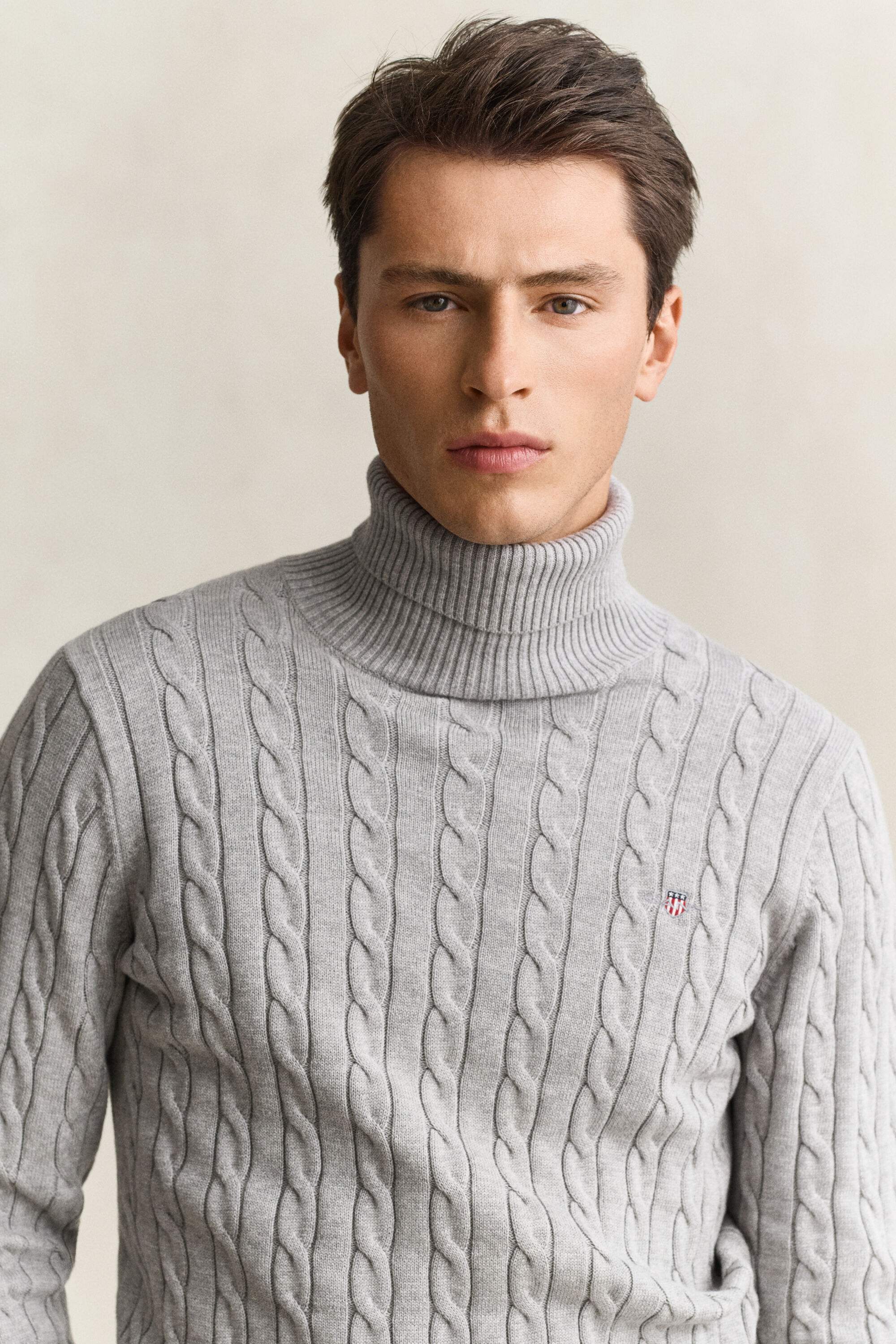Maglia a collo alto in cotone a trecce