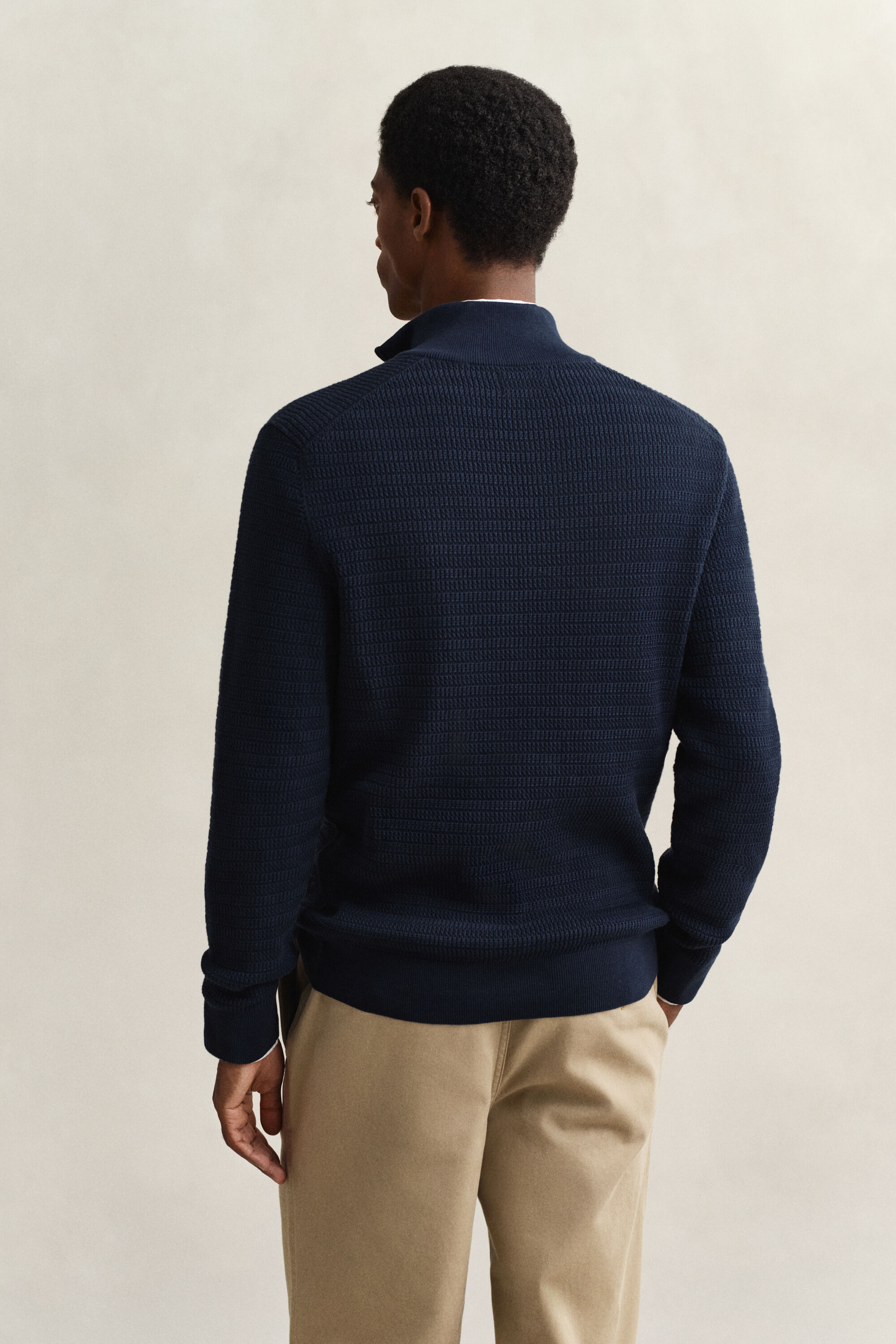 Maglia con zip corta a mini trecce