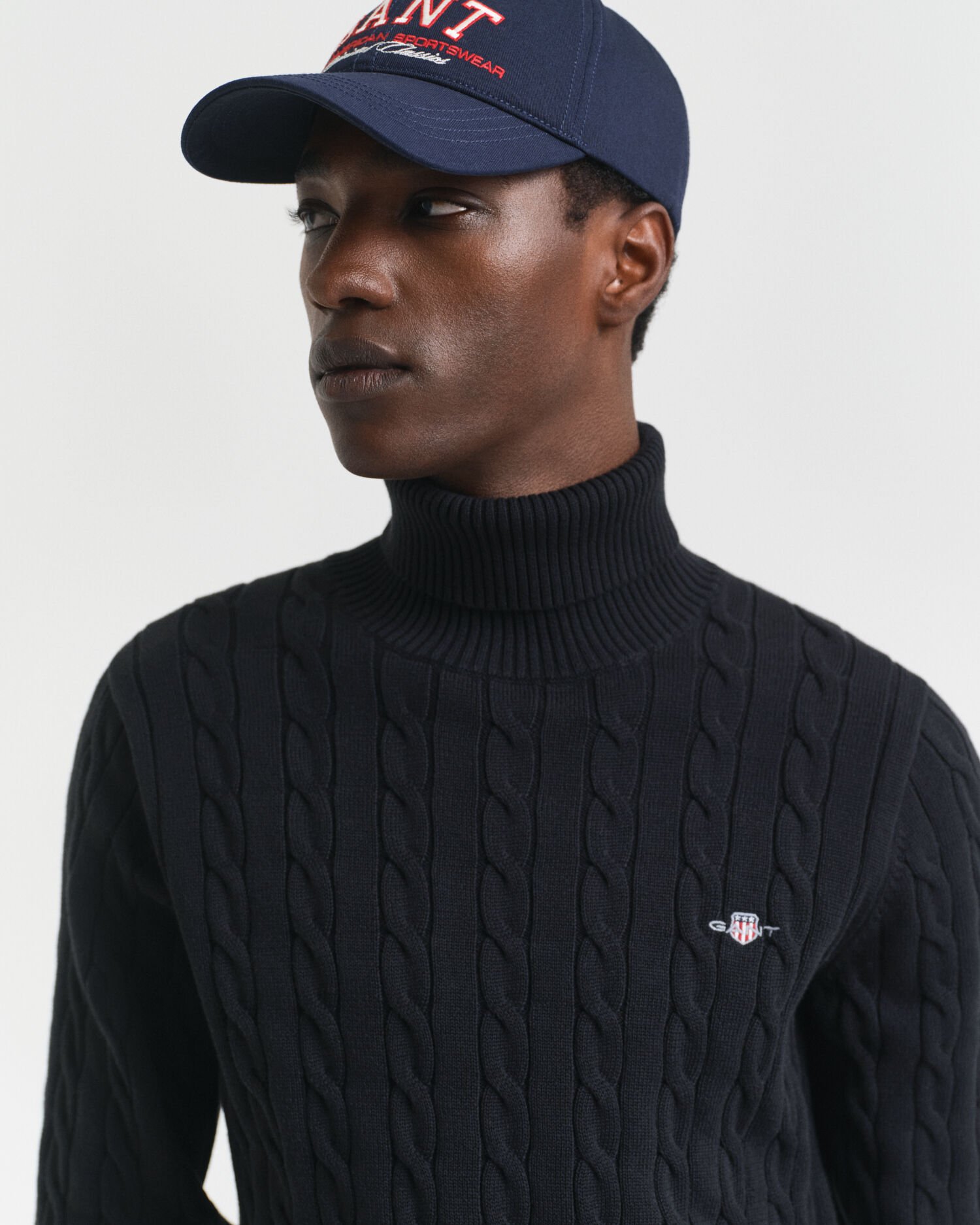 Maglia a collo alto in cotone a trecce