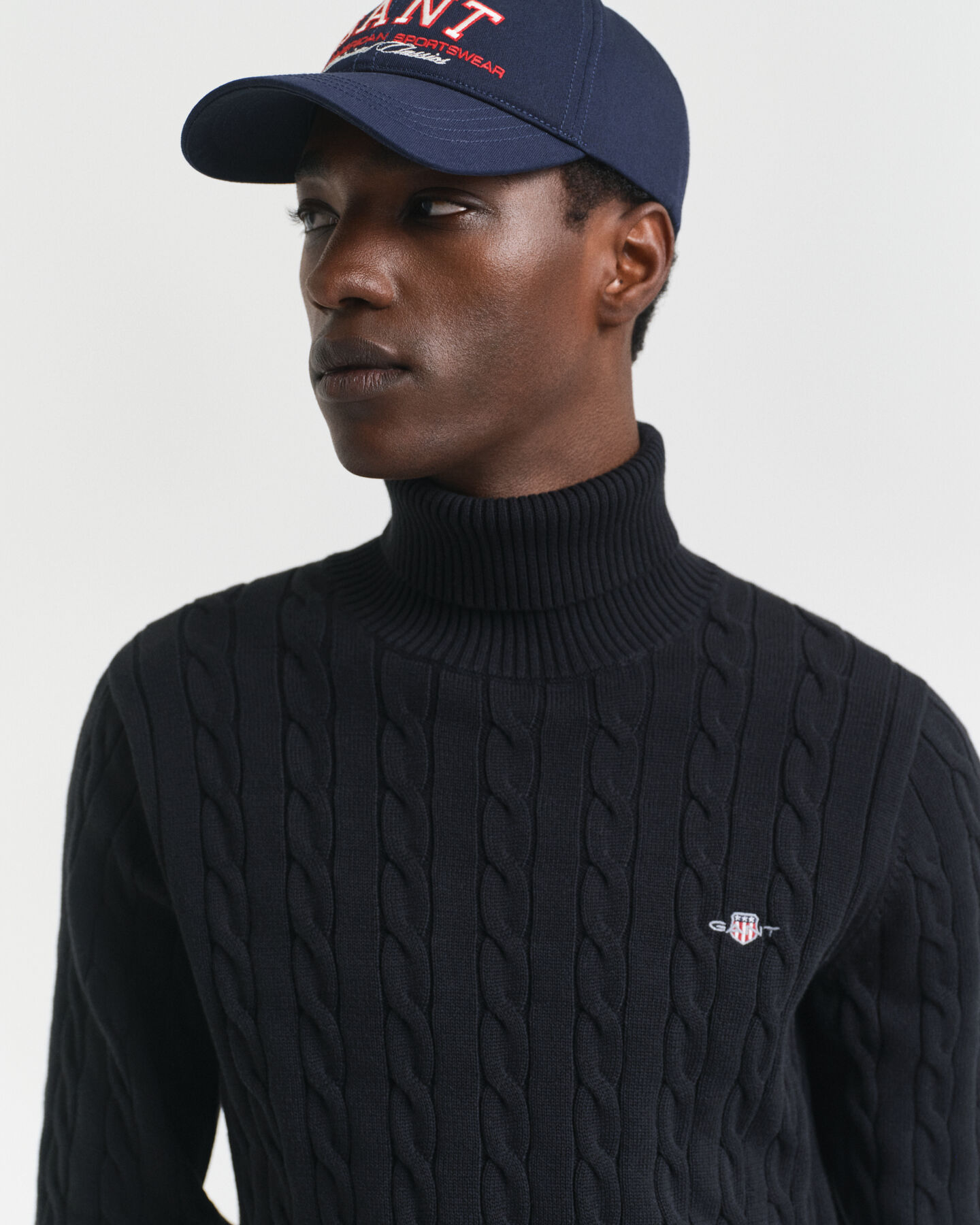 Maglia a collo alto in cotone a trecce