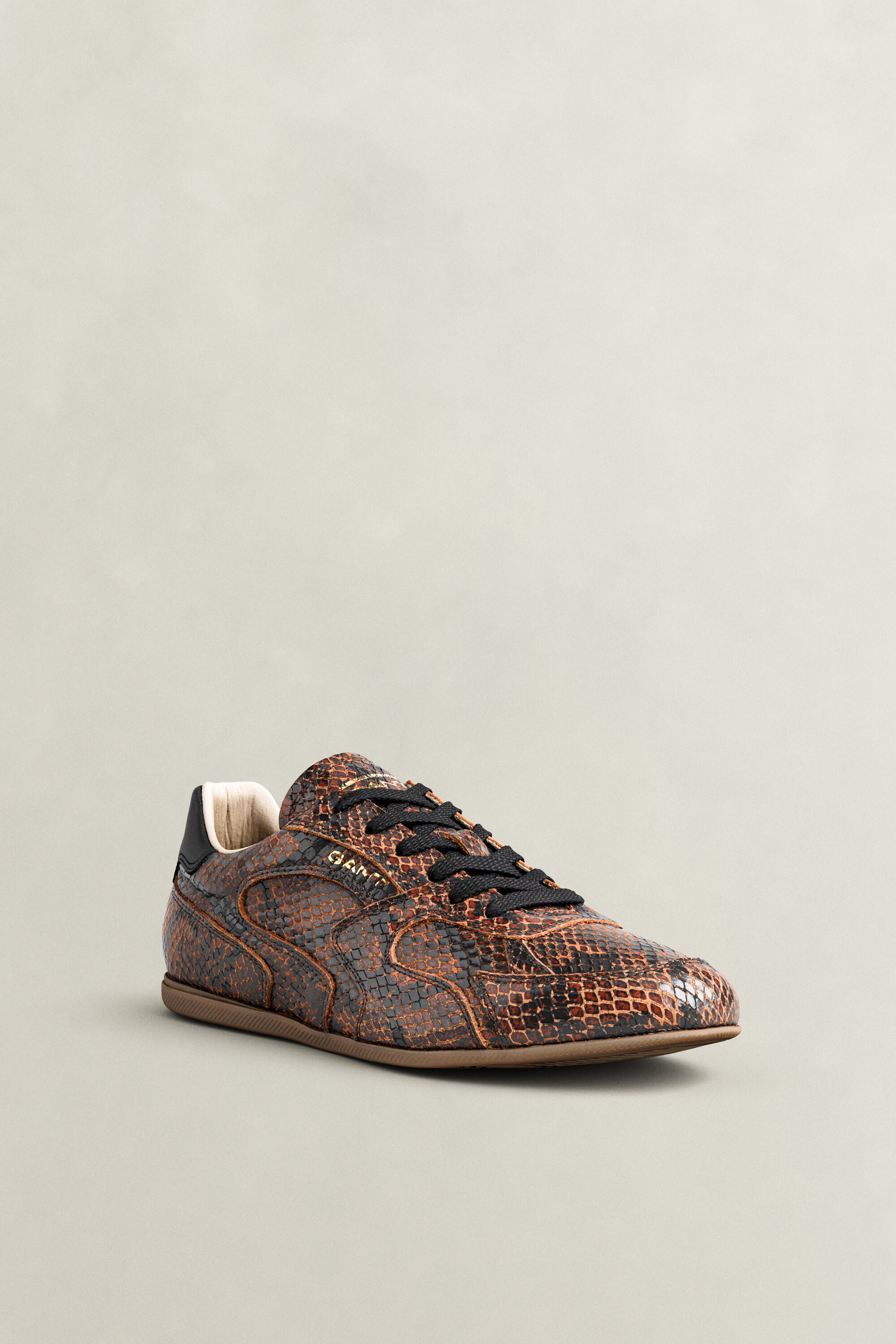 Sneakers Spelly in pelle con effetto serpente