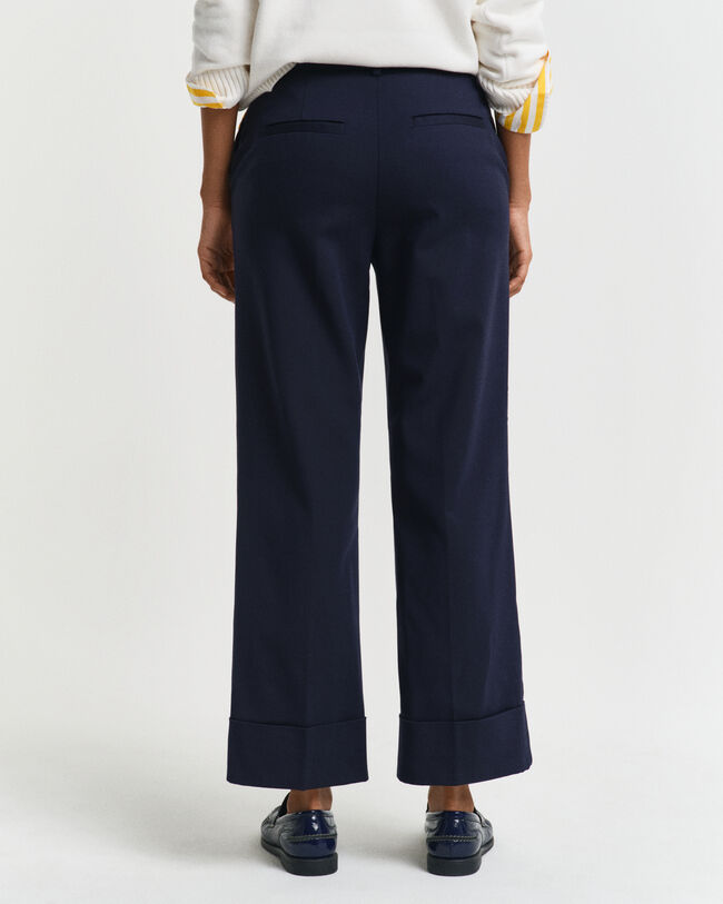 Pantaloni con piega e risvolto