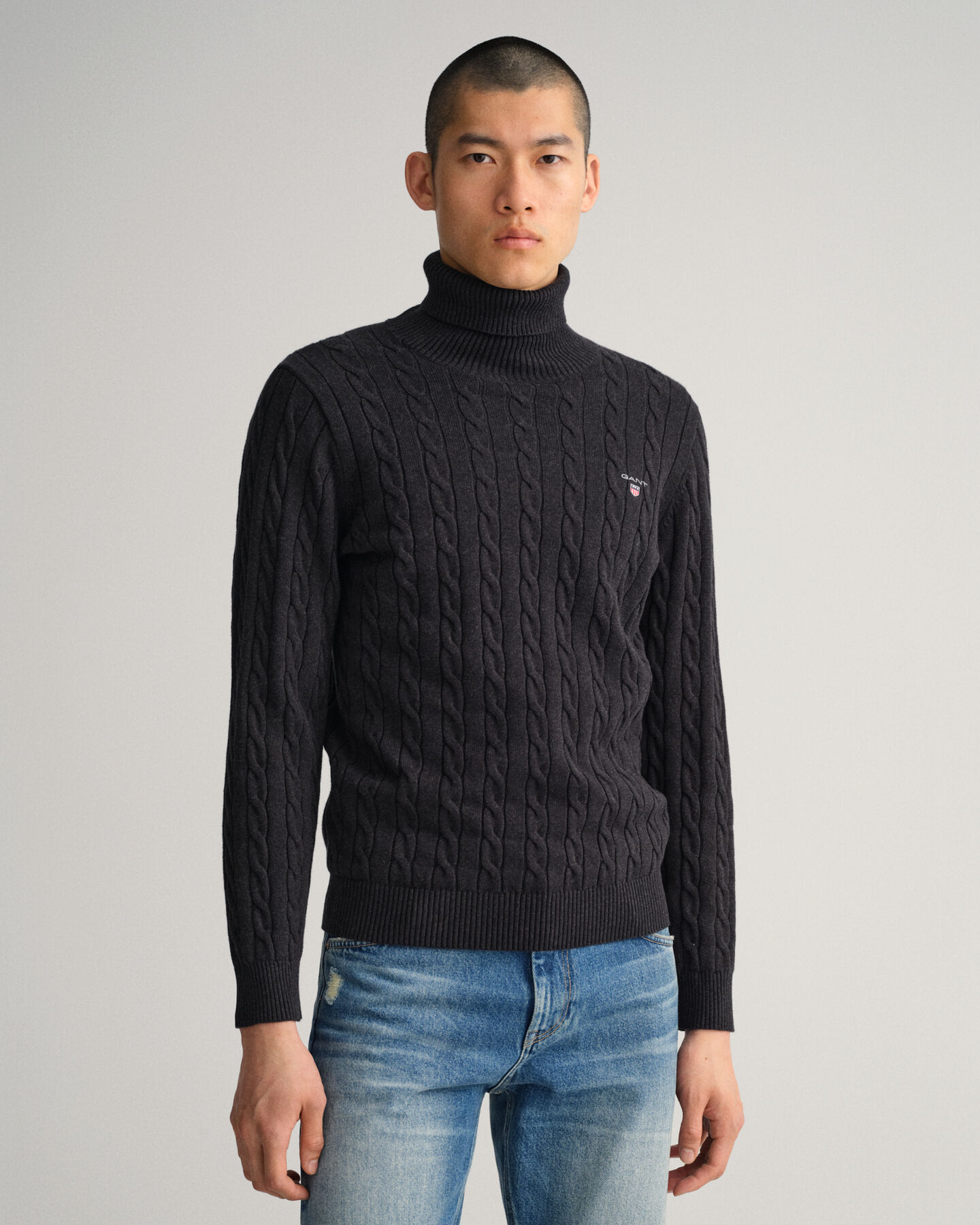 Maglia a collo alto in cotone a trecce