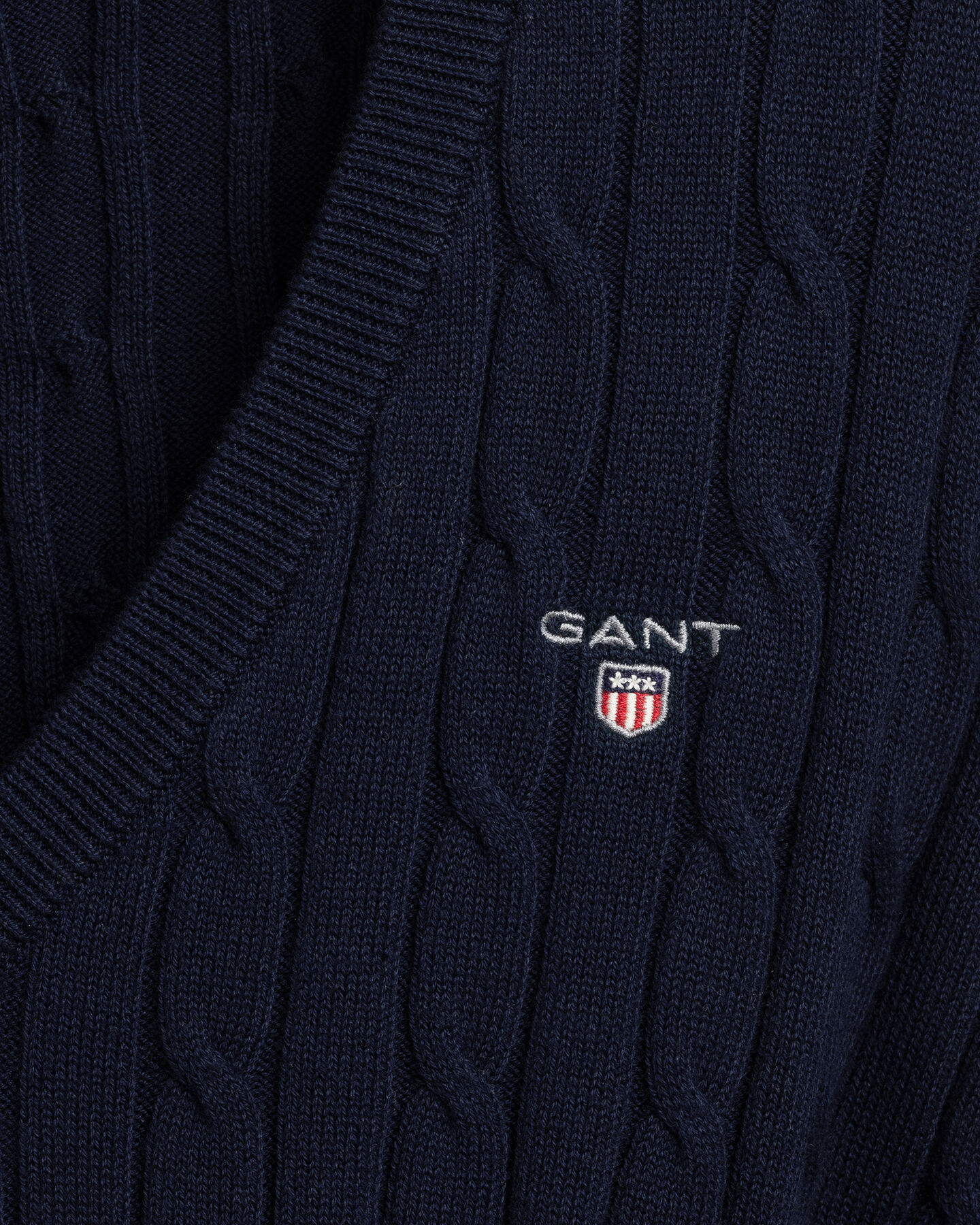 Maglia con scollo a V in cotone elasticizzato a trecce