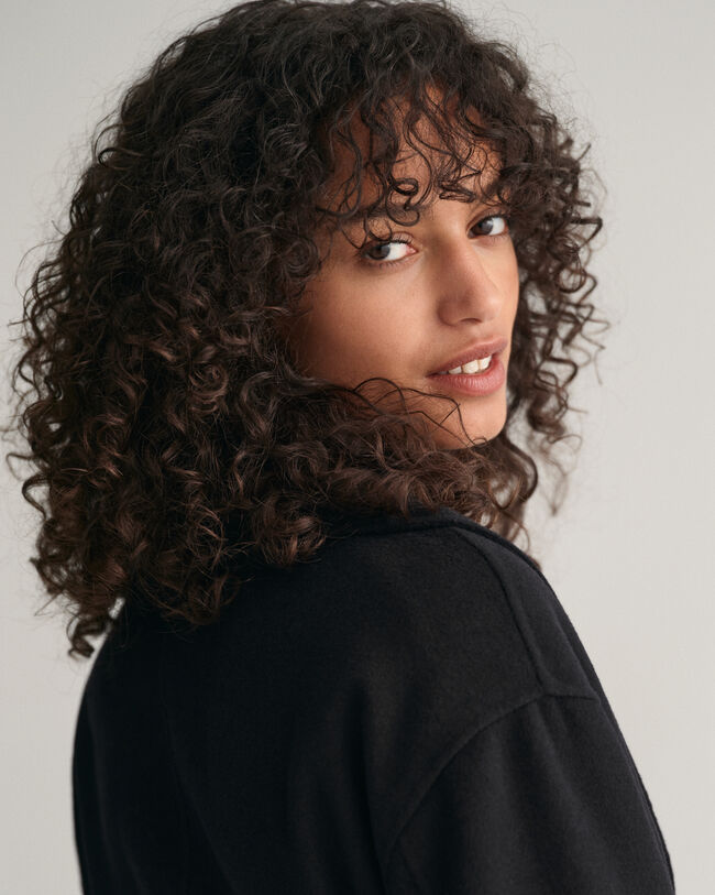 Cappotto con cintura e cuciture a mano