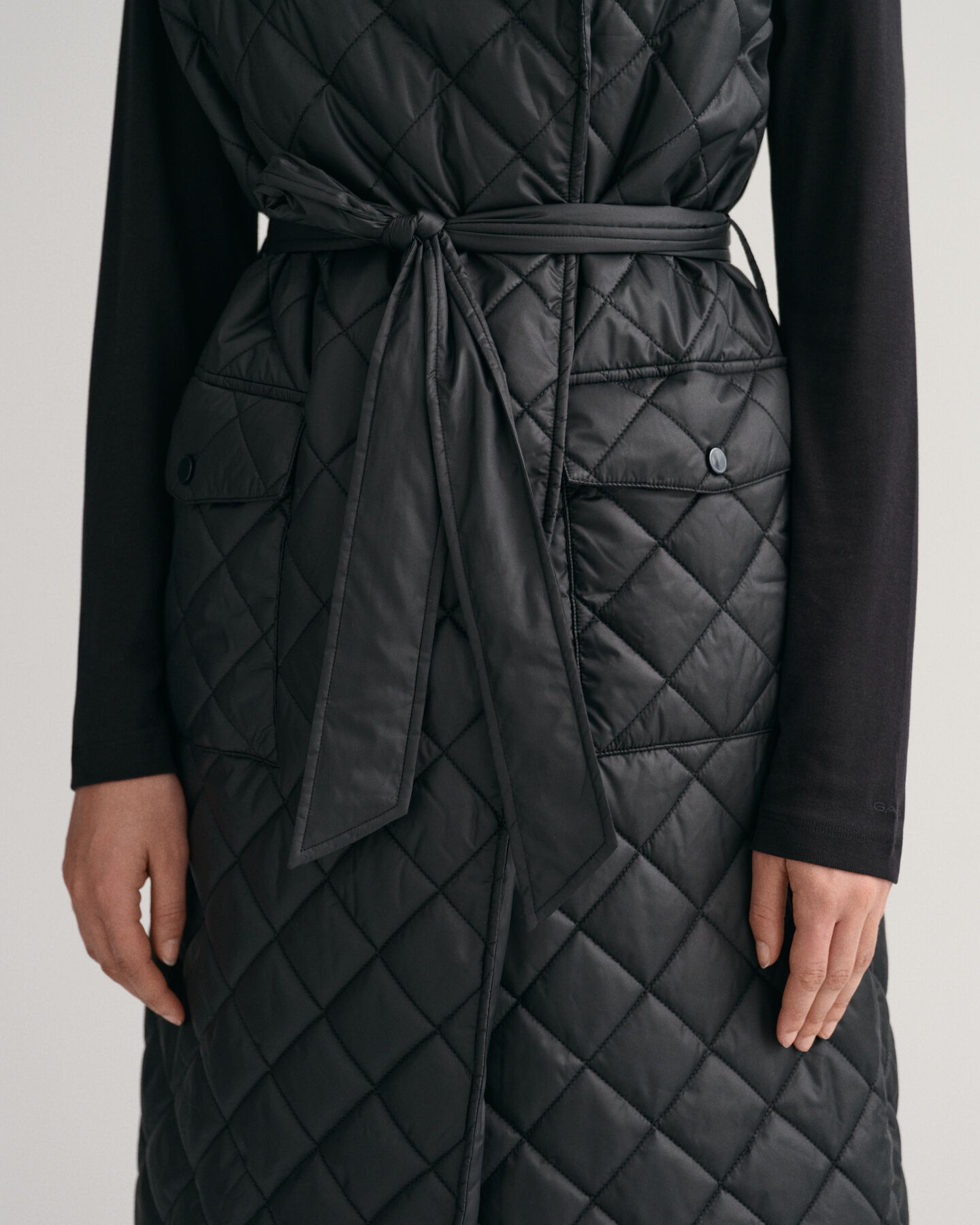 Piumino smanicato trapuntato lungo