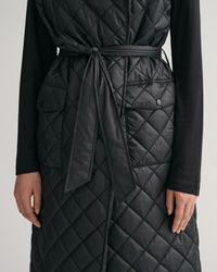 Piumino smanicato trapuntato lungo