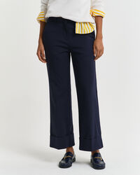 Pantaloni con piega e risvolto