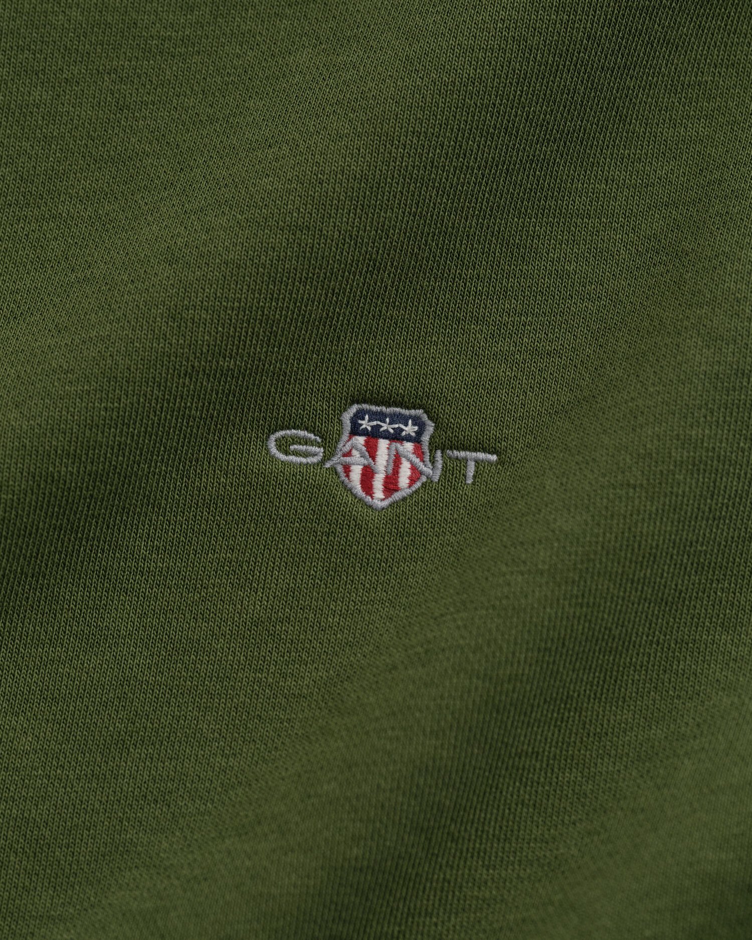 Felpa Shield con zip corta