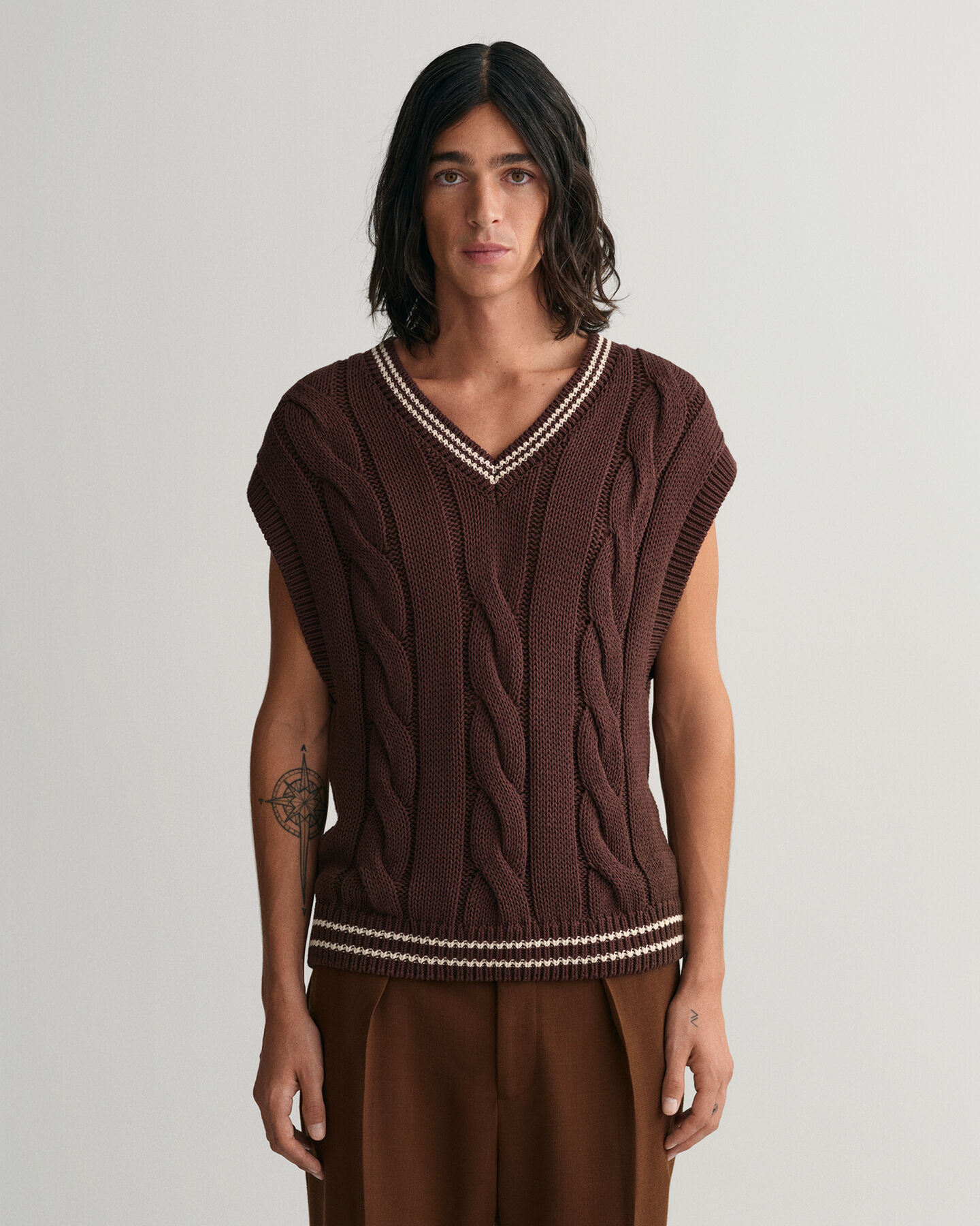 Smanicato in maglia a trecce