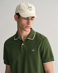 Polo in piqu&eacute; con bordino a contrasto