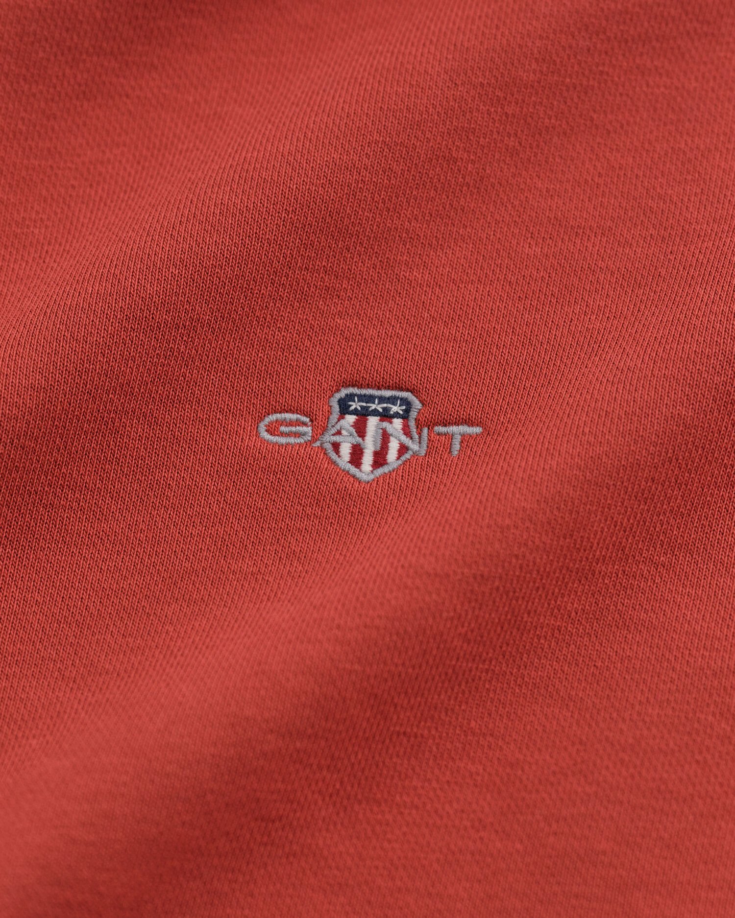 Felpa Shield con zip corta