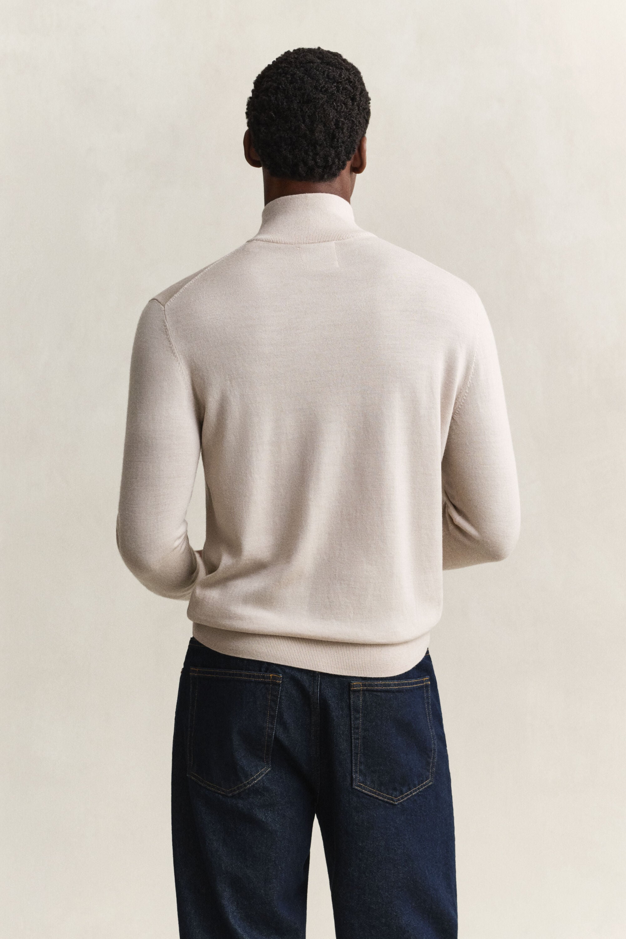 Maglia in lana merino a coste con zip corta