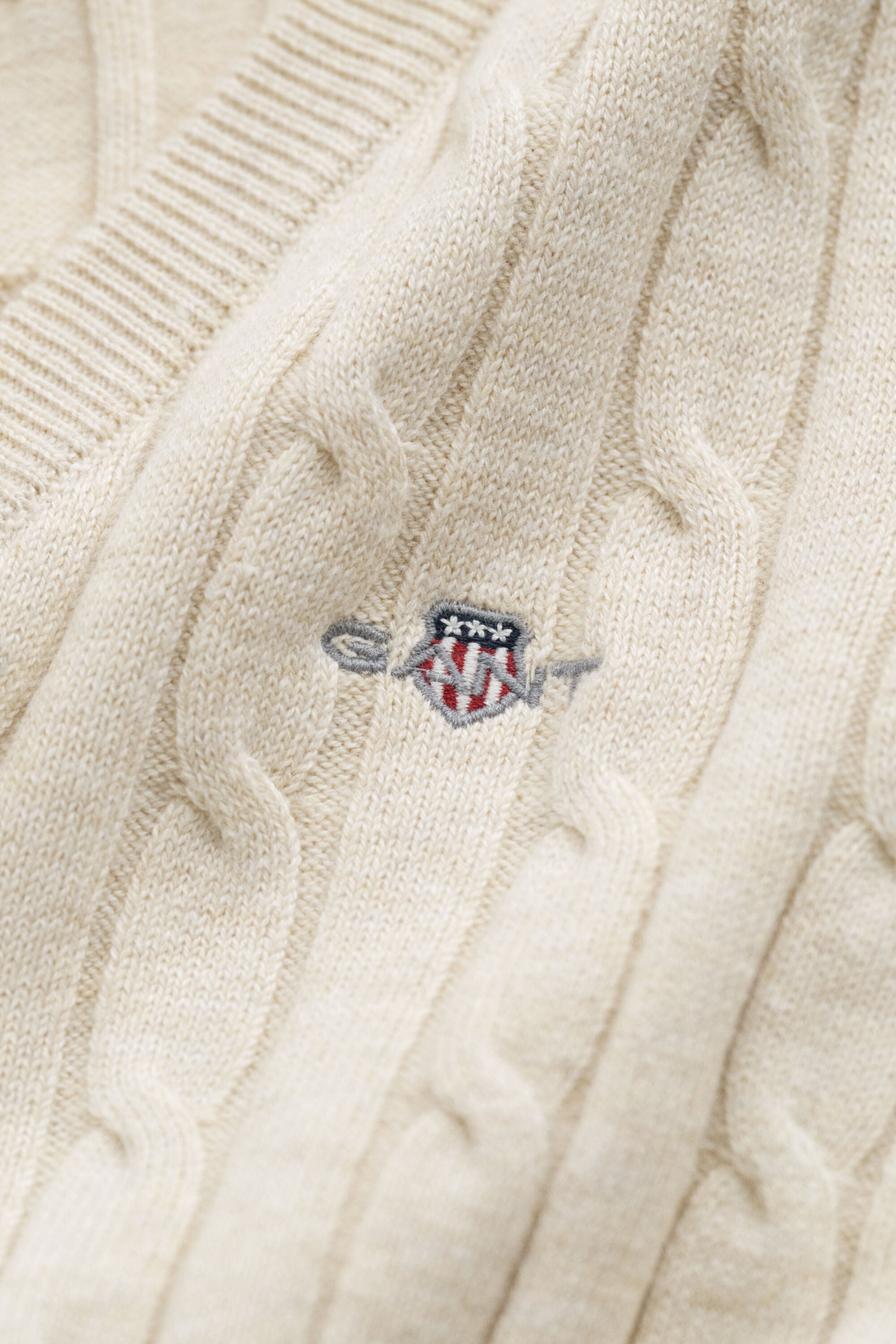Maglia con scollo a V in cotone elasticizzato a trecce