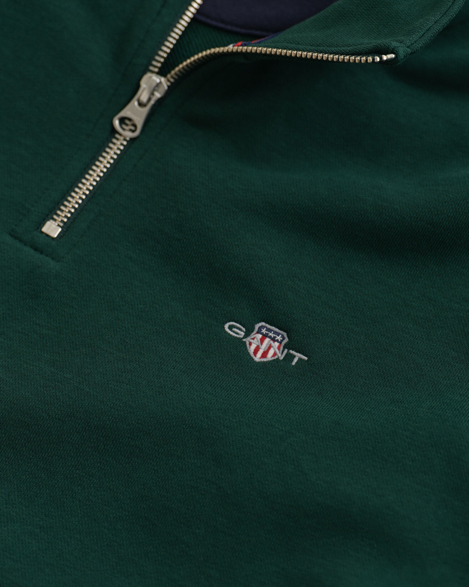 Felpa Shield con zip corta