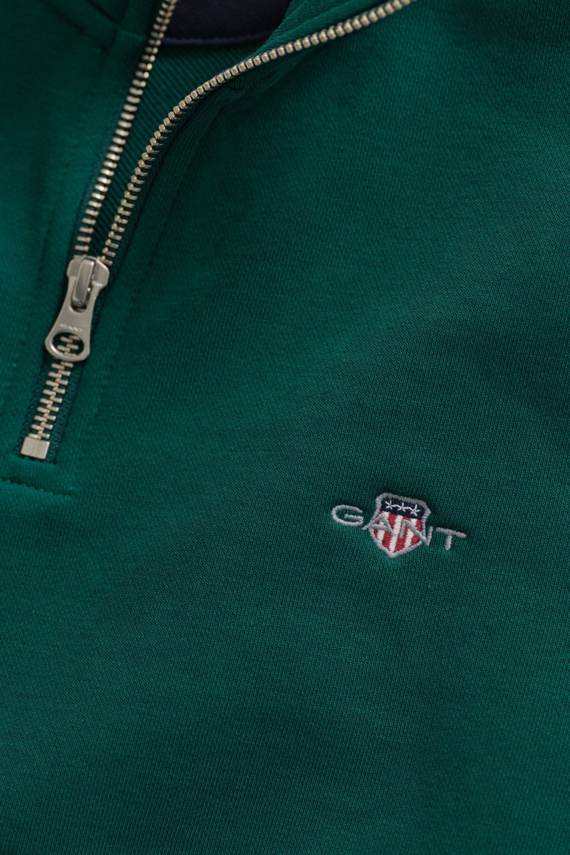 Felpa Shield con zip corta