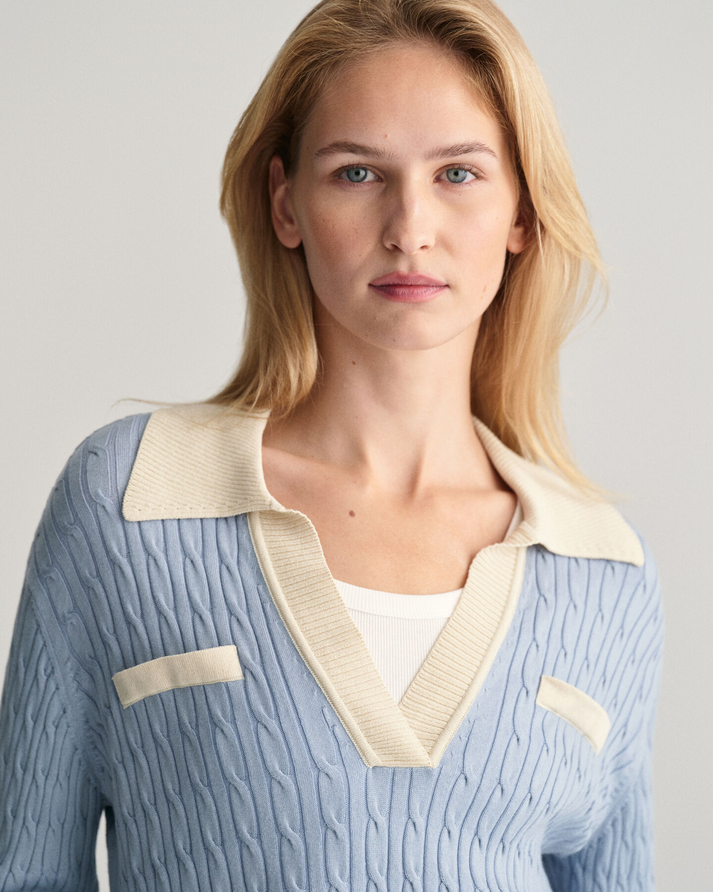 Polo in maglia a trecce