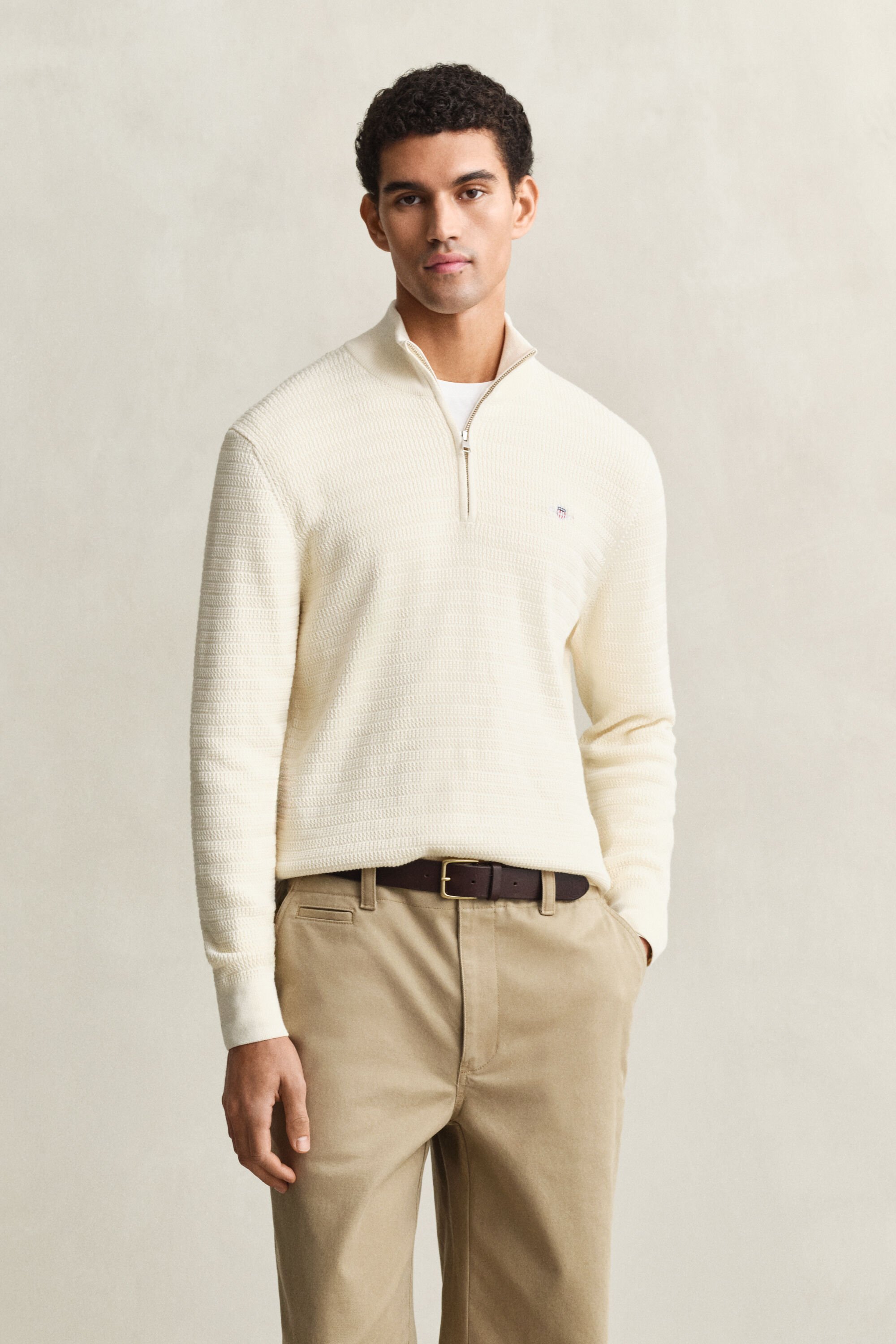 Maglia con zip corta a mini trecce