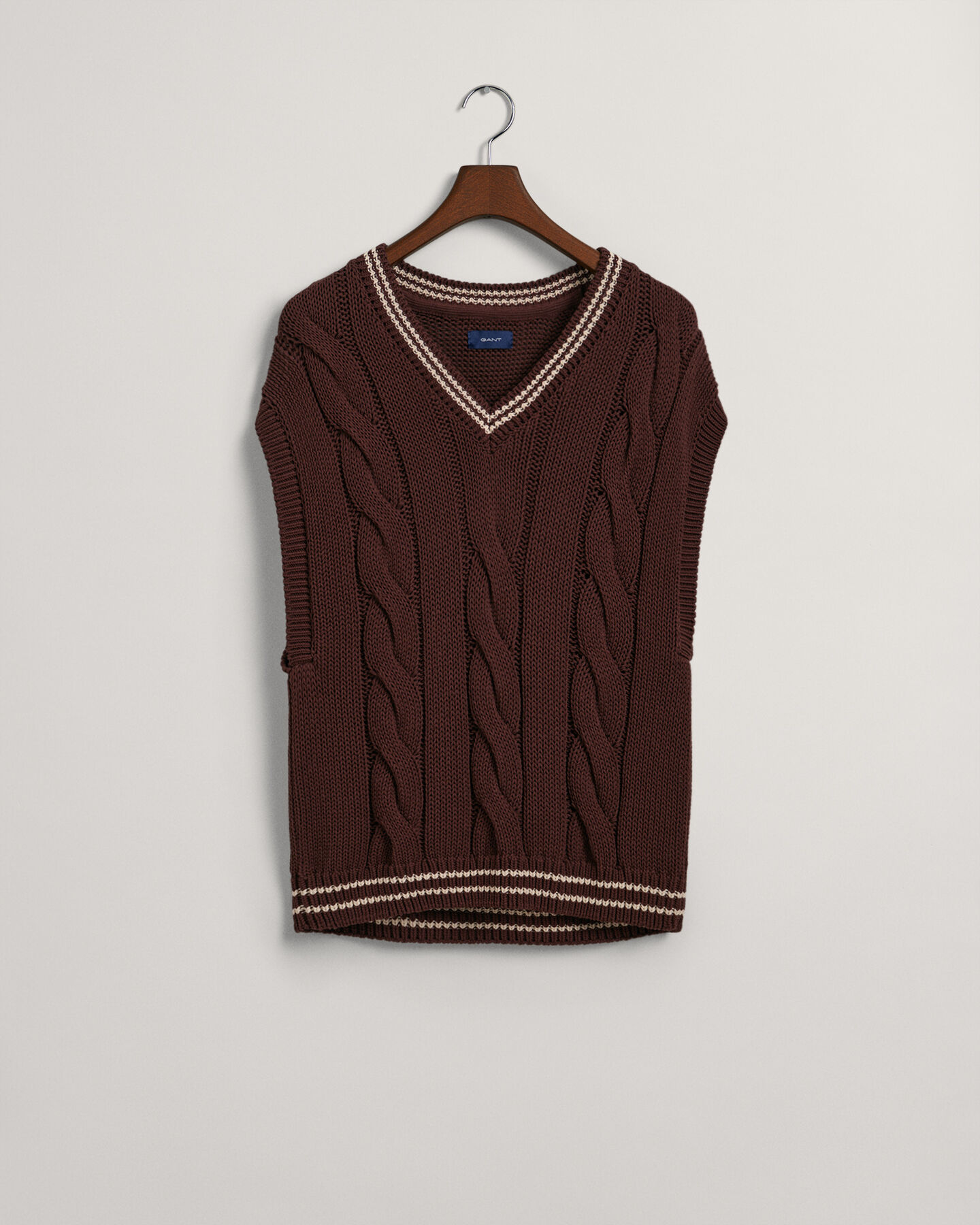 Smanicato in maglia a trecce