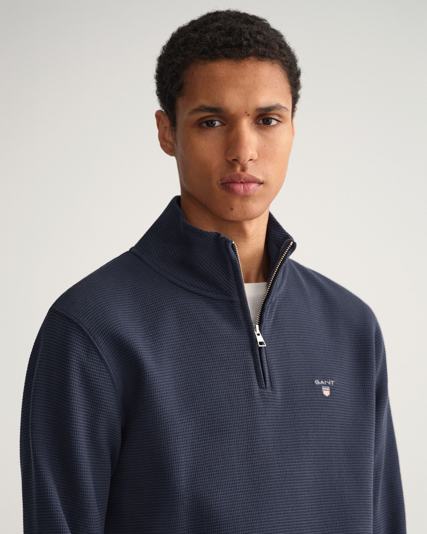 Felpa Waffle con zip corta