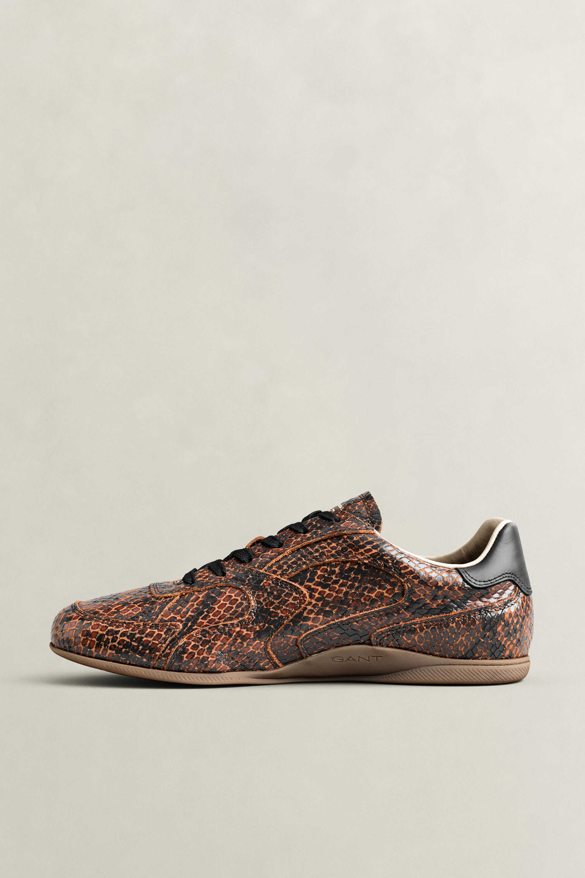 Sneakers Spelly in pelle con effetto serpente
